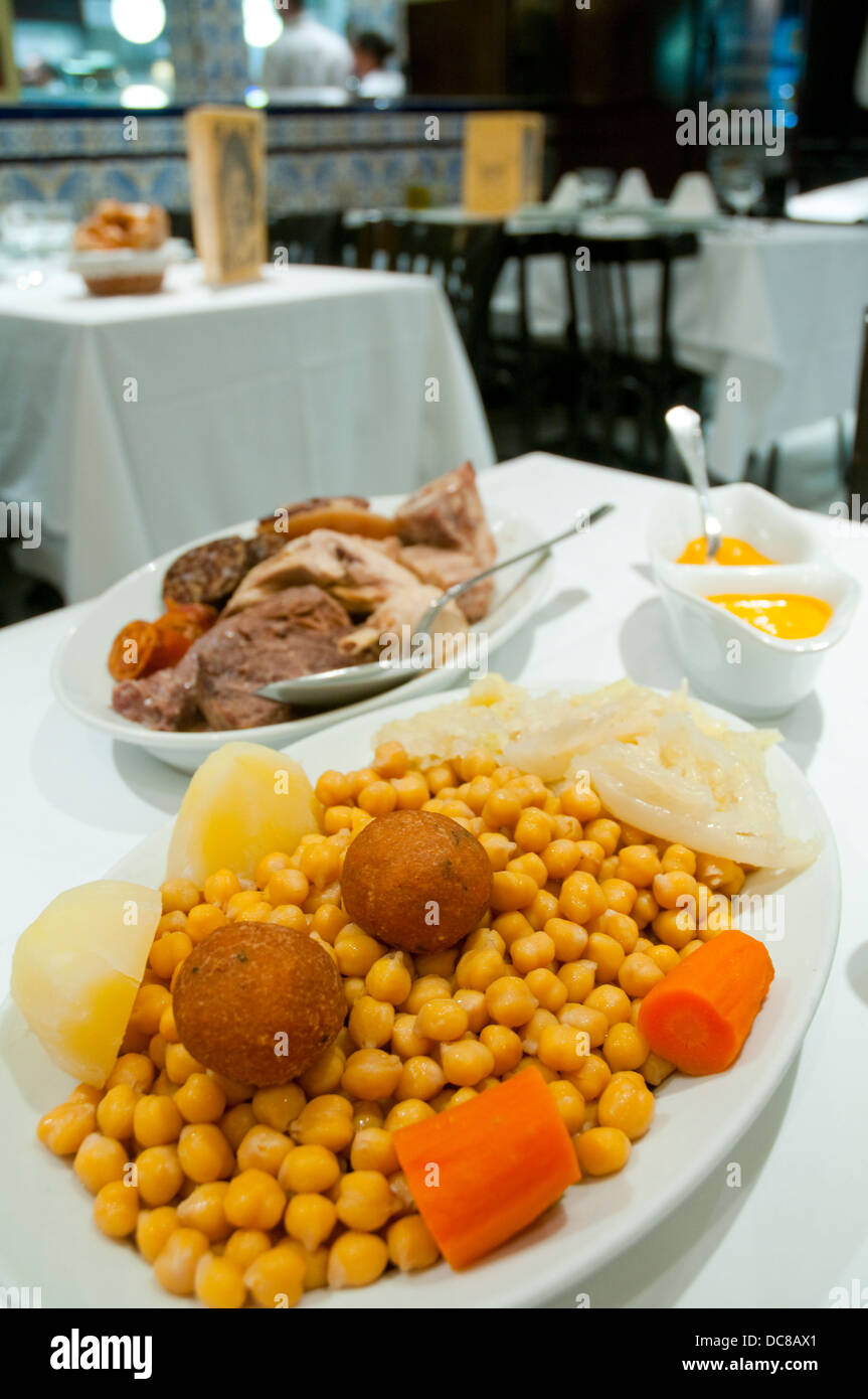 Cocido madrileño serving in a typical restaurant. Madrid, Spain. Stock Photo