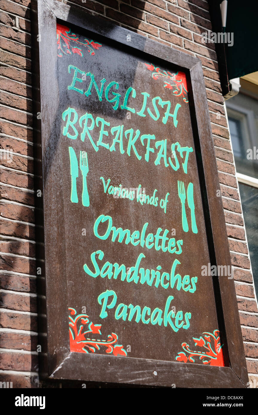 Sign outside a pub advertising English Breakfasts, Omlettes, Sandwiches and Pancakes Stock Photo