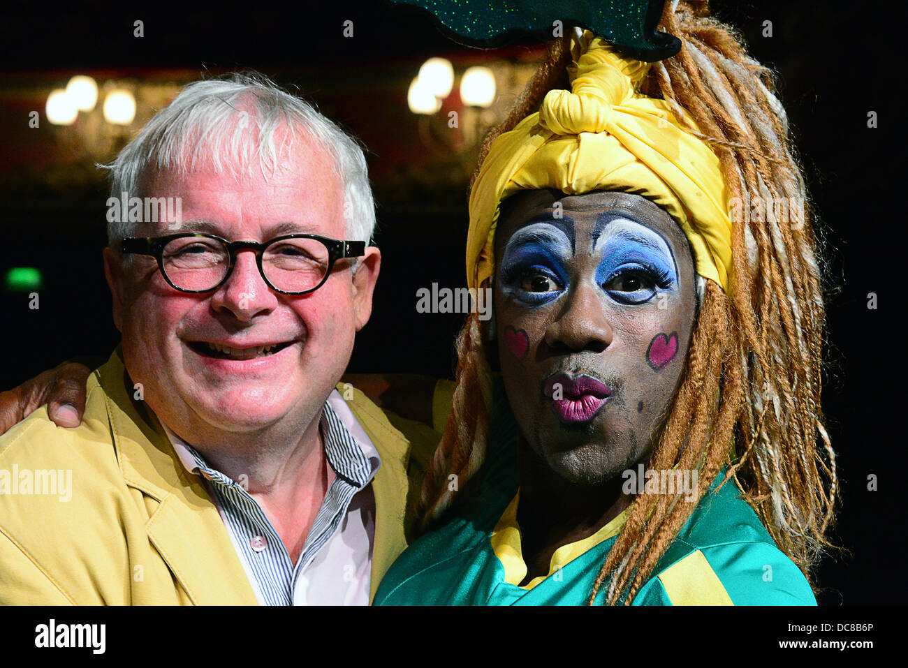 London UK 12th August 2013 : St Joseph's Hospice and Hackney Empire's Dame Dash Photocall with  Christopher Biggins (yellow jacket, along with a pantomime cow. Credit:  See Li/Alamy Live News Stock Photo