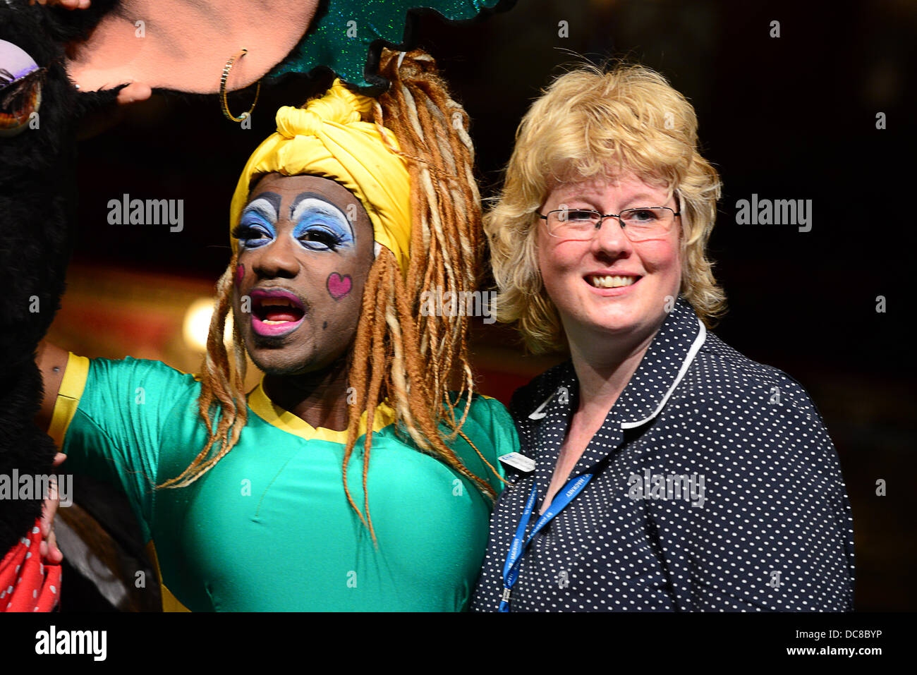 London UK 12th August 2013 : St Joseph's Hospice and Hackney Empire's Dame Dash Photocall with cast join Christopher Biggins (yellow jacket, along with a pantomime cow. Credit:  See Li/Alamy Live News Stock Photo