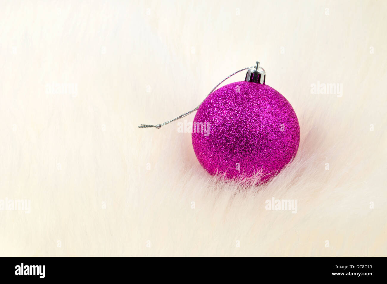 Christmas decoration - Single bauble on top of fur Stock Photo