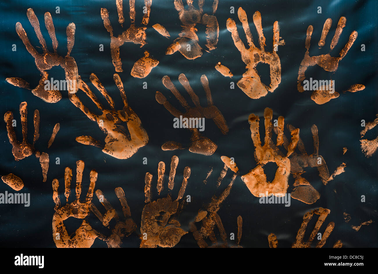 Handprints made with red paint on plastic Stock Photo Alamy