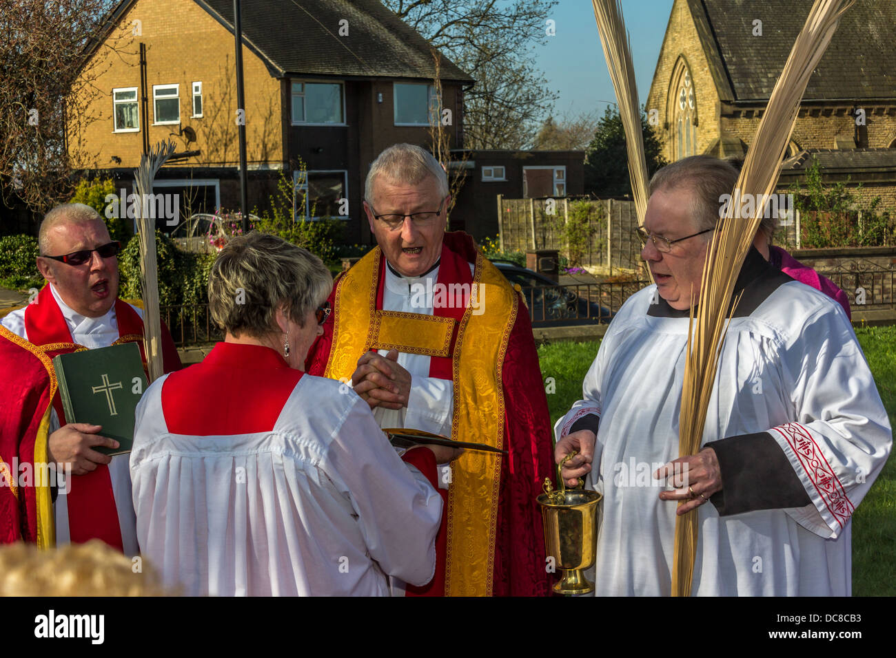 Anglican Priest Blessing Palm crosses on Palm Sunday Stock Photo
