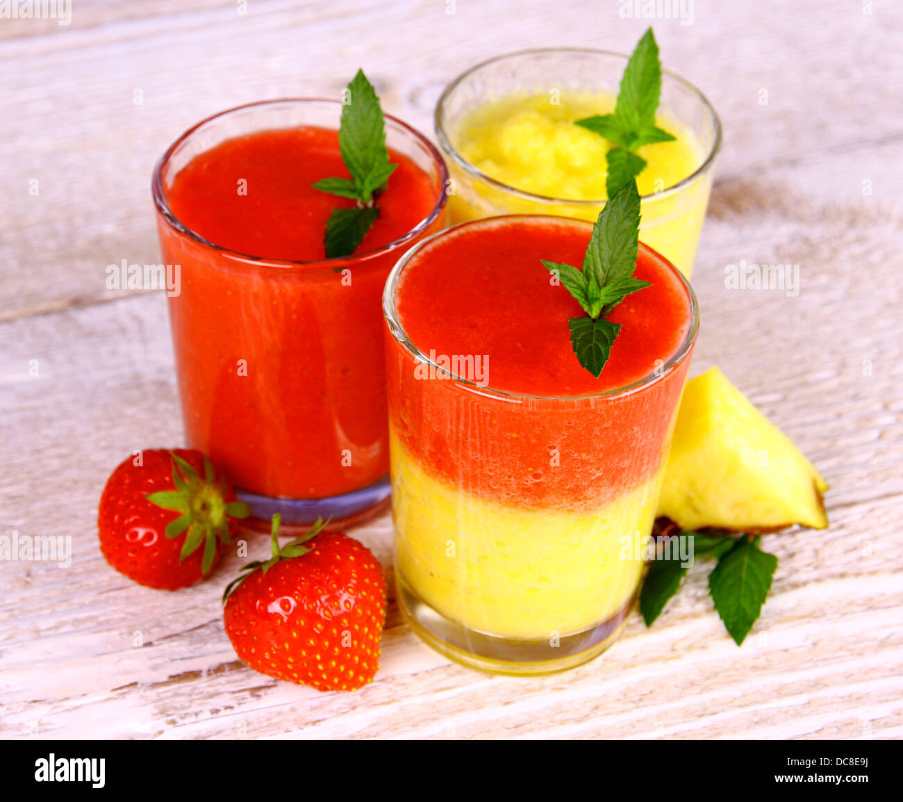 Strawberry and pineapple smoothie in glass mixed, close up Stock Photo