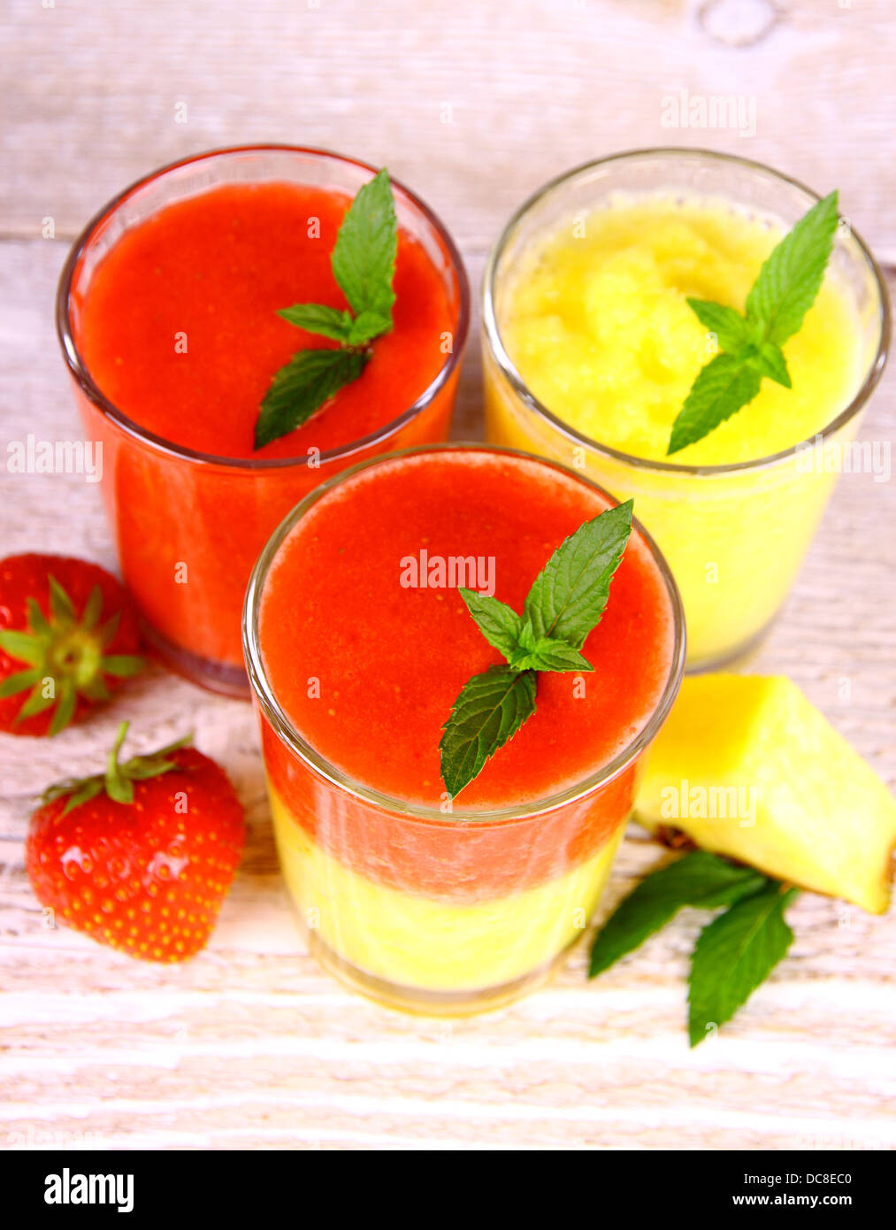 Strawberry and pineapple smoothie in glass mixed, top view Stock Photo
