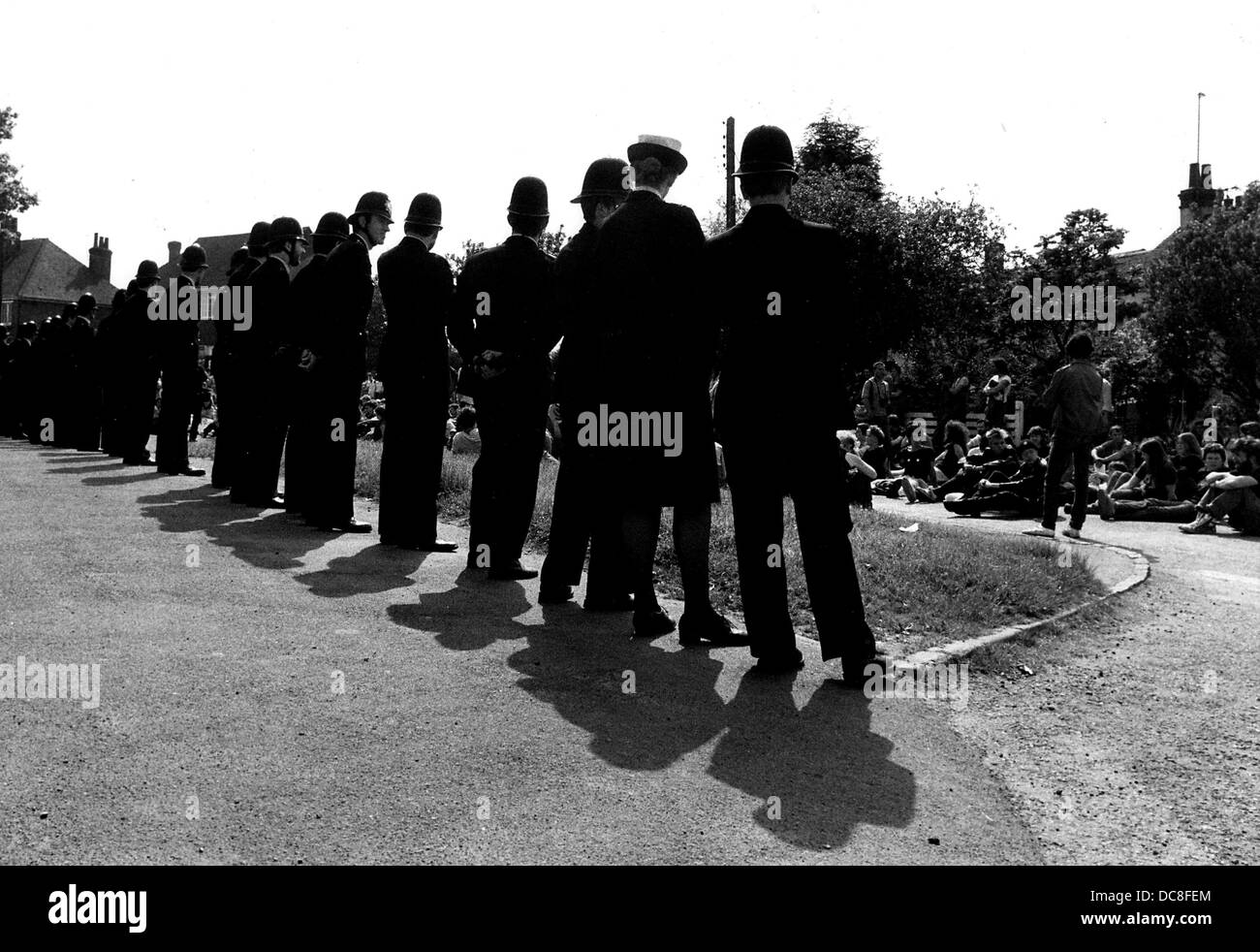 Police line up opposite Animal Rights Campaigners protesting at Shamrock Farm at Small Dole near Henfield West Sussex in 1983 Stock Photo