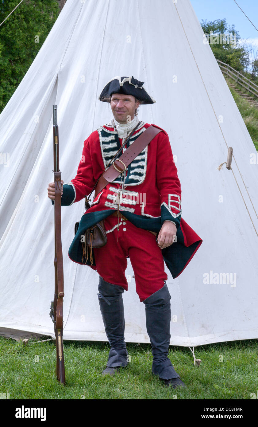 A 18C redcoat soldier in the British Army, holding Brown Bess Musket,  standing as guard against white tent at re-enactment event, Tutbury Castle,  UK Stock Photo - Alamy