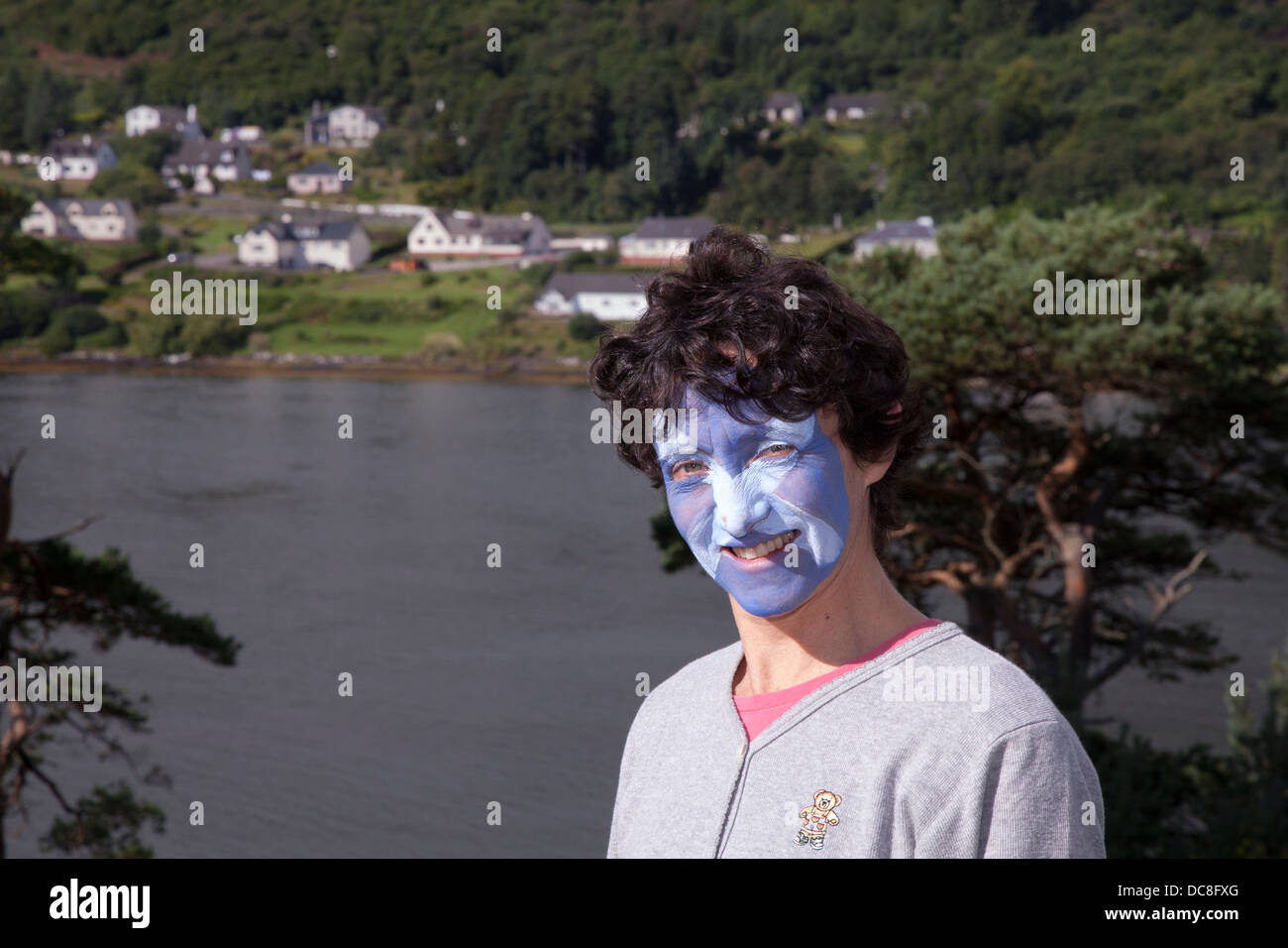 Sykvie Aprosio, a tourist from France, with a Scottish blue & white saltire painted face at the Isle of Skye Games, UK Stock Photo
