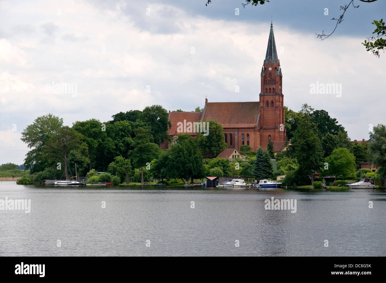 View over part of Müritz Lake to St. Marys church in Röbel, Mecklenburg, Germany Stock Photo