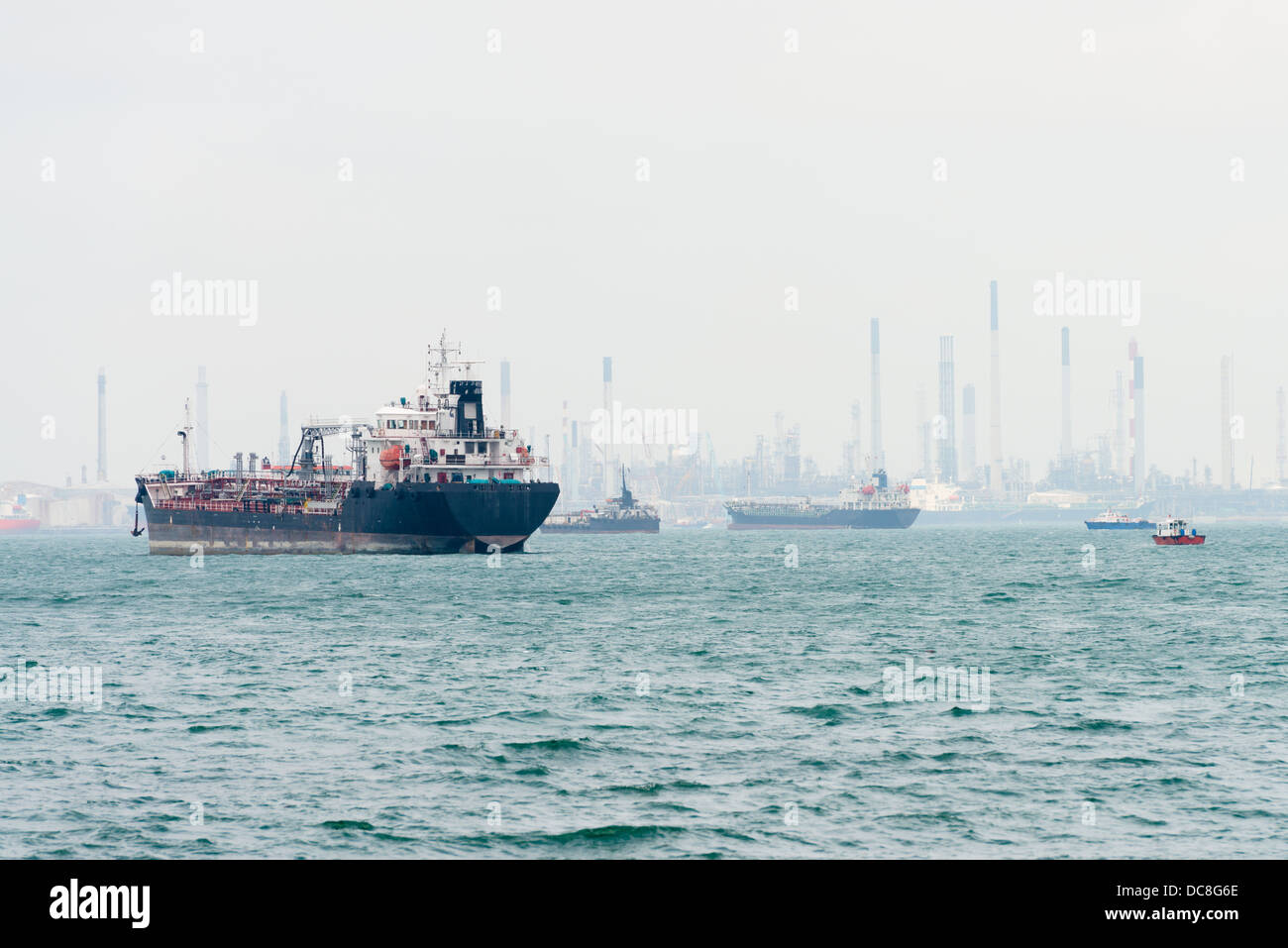 Oi tanker on the sea near a port and oil-processing center, Singapore Stock Photo