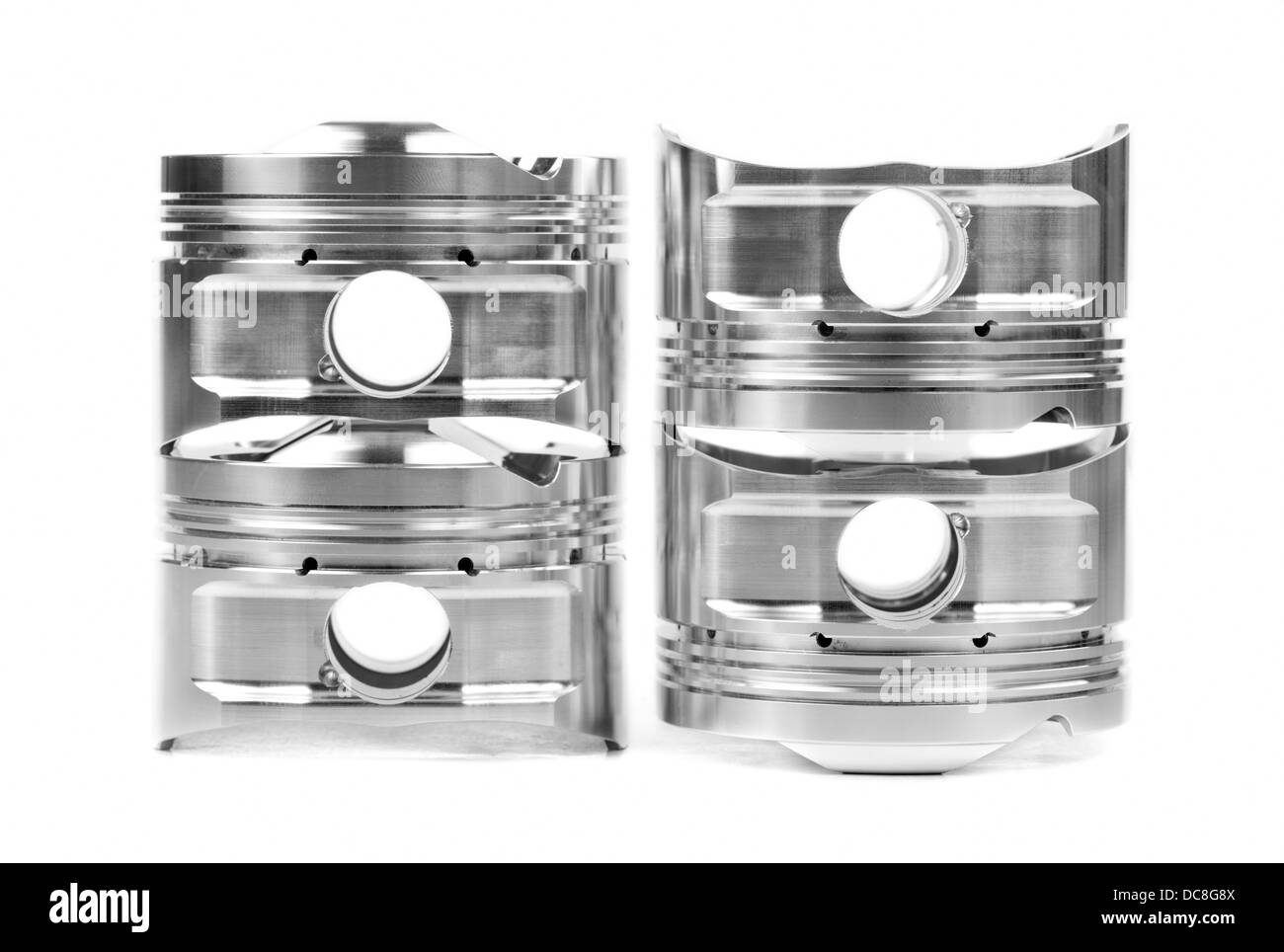 Set of four chromeplated pistons. Isolate on white Stock Photo