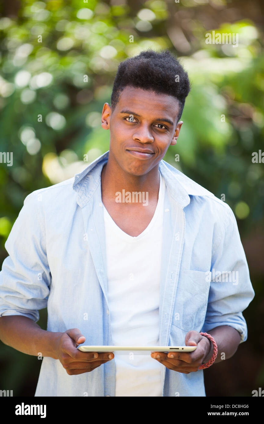 Young man on a digital tablet Stock Photo