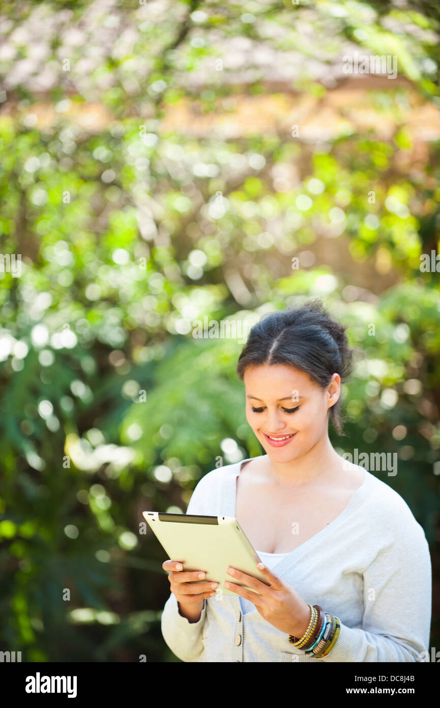 Young girl on a digital tablet Stock Photo