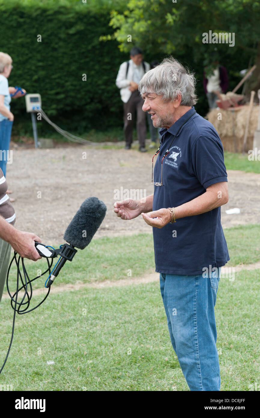Robin Page farmer broadcaster and journalist giving a radio interview