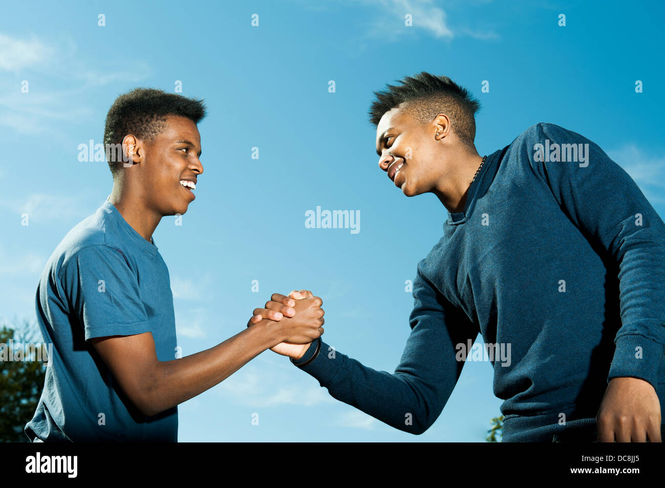 Friends greeting each other Stock Photo