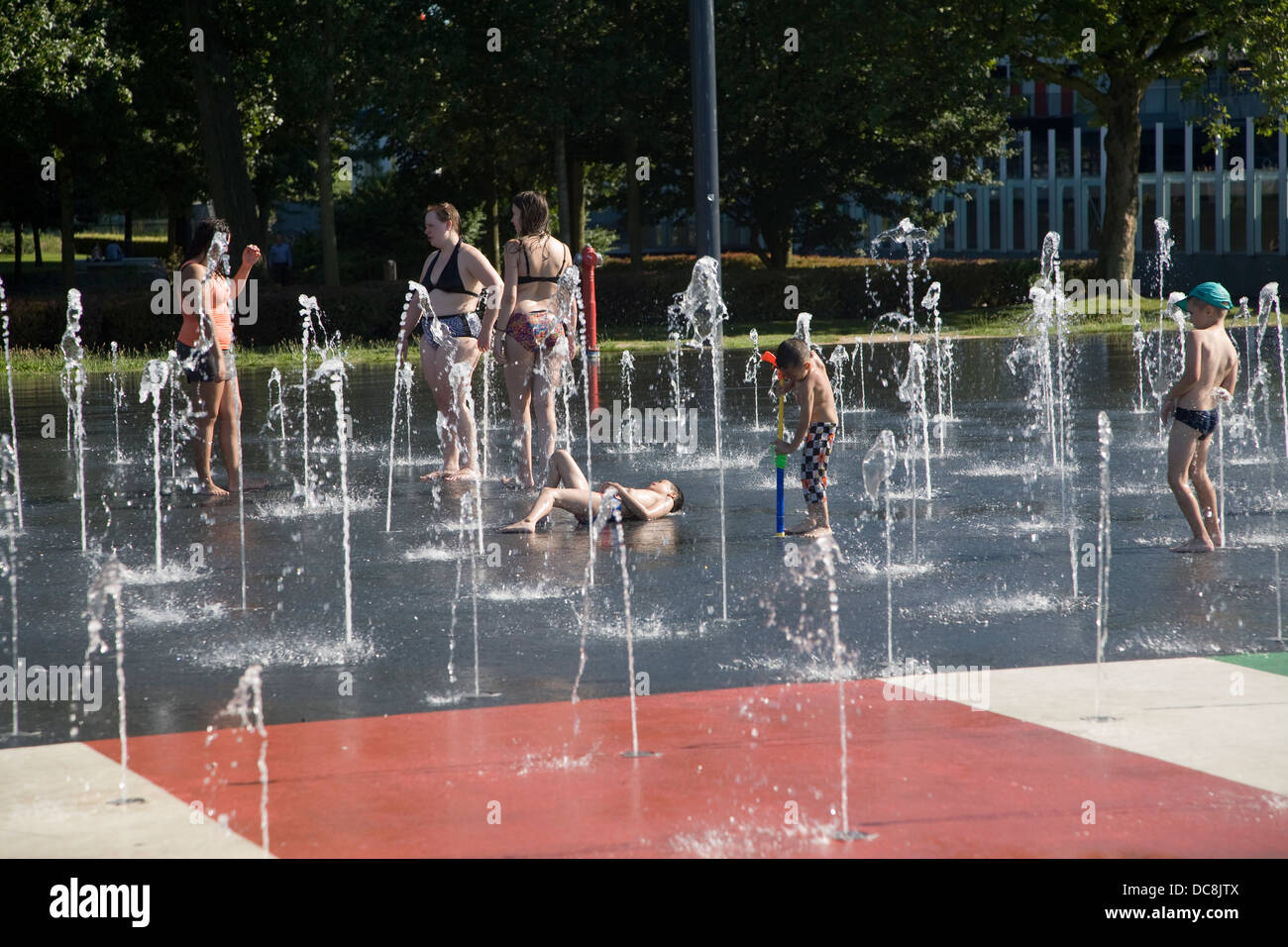 Children teenagers cooling off water fountains Museum Park Rotterdam Netherlands Stock Photo
