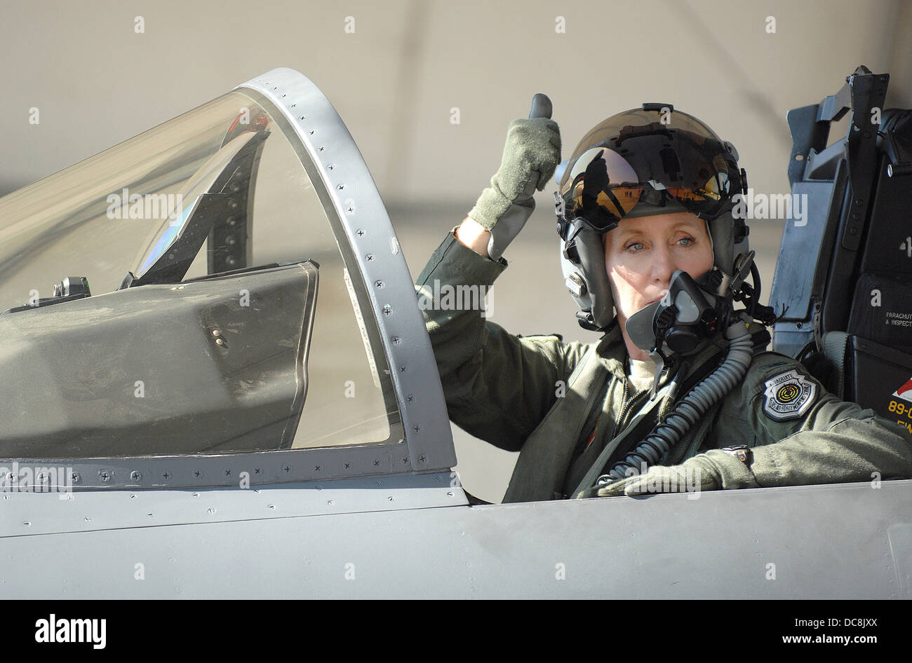 US Air Force Col. Jeannie Leavitt, the commander of the 4th Fighter Wing, signals her crew chief before taking off in a F-15E Strike Eagle fighter aircraft July 17, 2013 from Seymour Johnson Air Force Base, NC. The 336th Fighter Squadron resumed flying after a three-month suspension due to budget cuts. Stock Photo