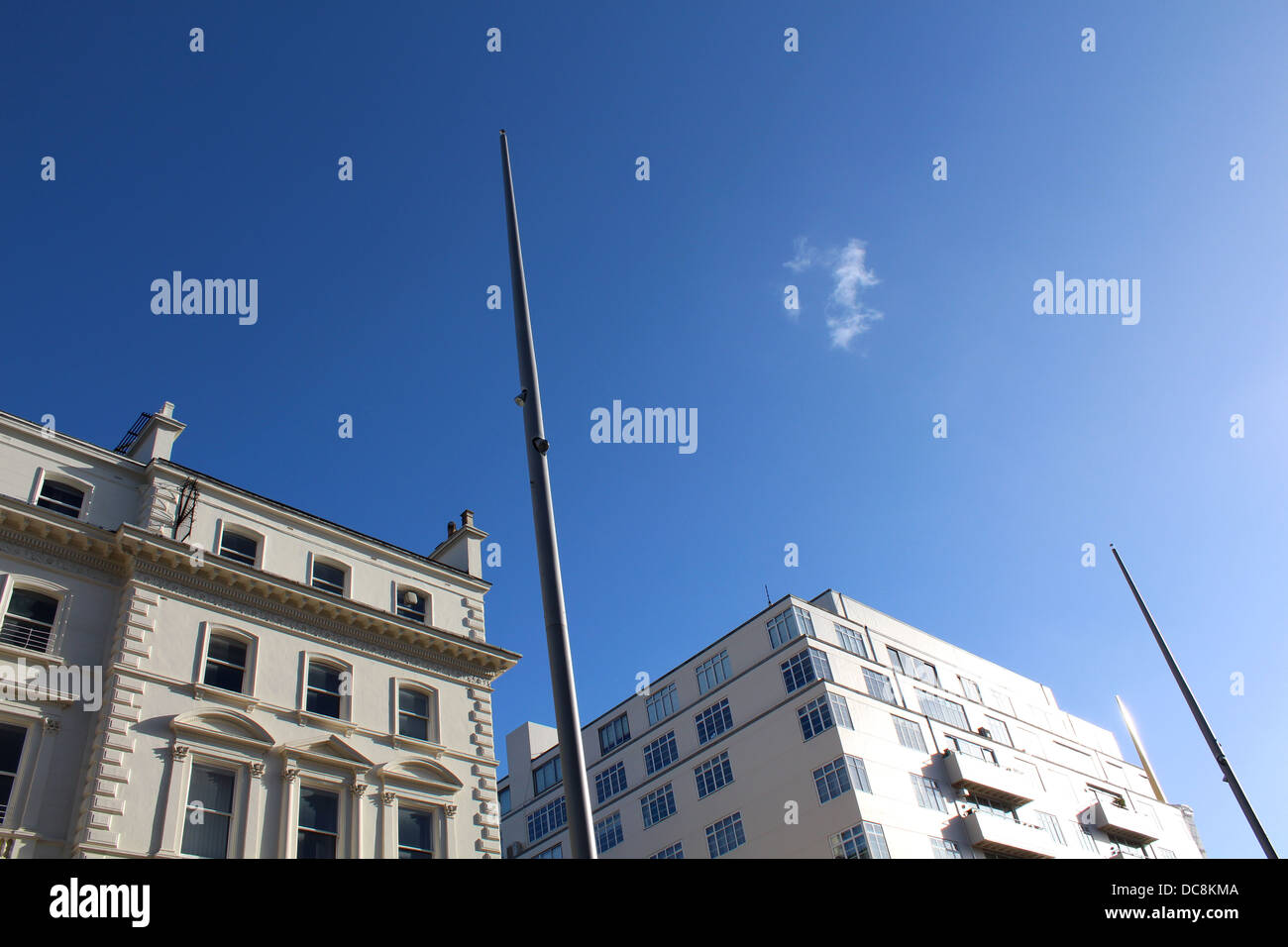 Two white buildings along Kensington gore with a single cloud in the sky Stock Photo