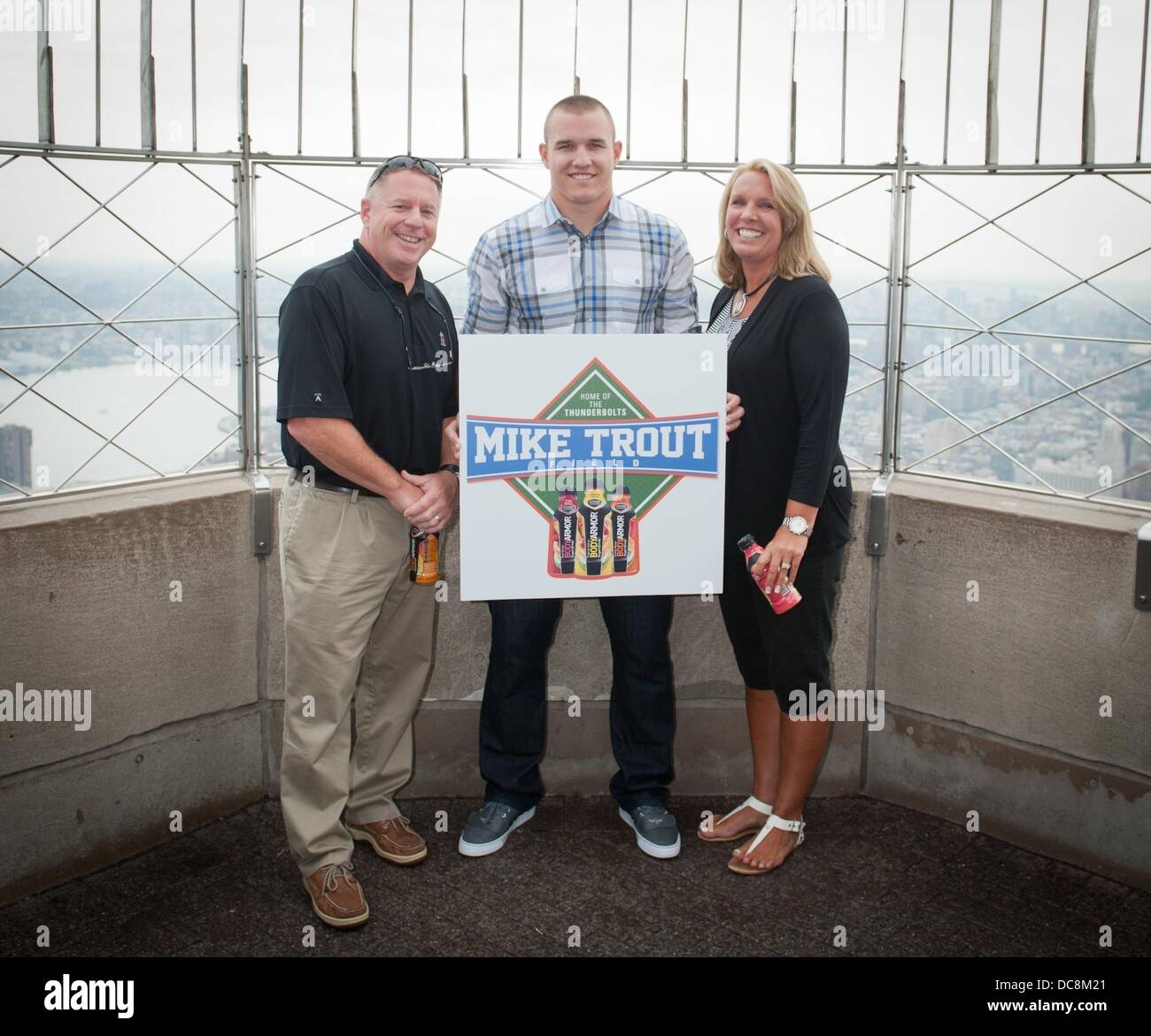 Manhattan, New York, USA. 12th Aug, 2013. Los Angeles Angels of Anaheim outfielder MIKE TROUT, with his parents Jeff and Debbie, tours the Empire State Building's 86th floor Observatory and is interviewed at Foley's NY Pub & Restaurant on 33rd Street, Monday, August 12, 2013. Credit:  Bryan Smith/ZUMAPRESS.com/Alamy Live News Stock Photo