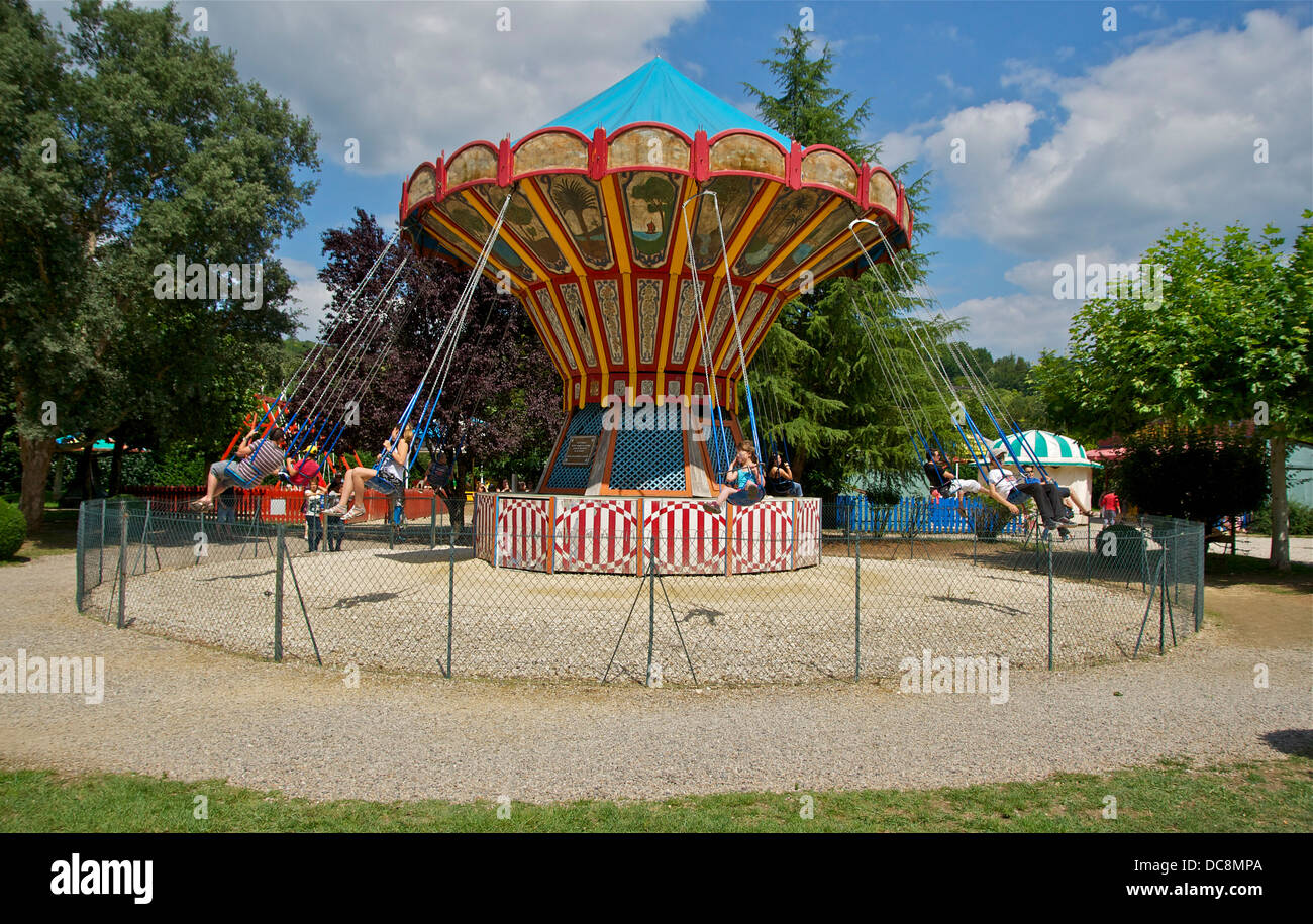 A chair-O-planes carousel, old village of Le Bournat, Le Bugue, Dordogne, France. Stock Photo