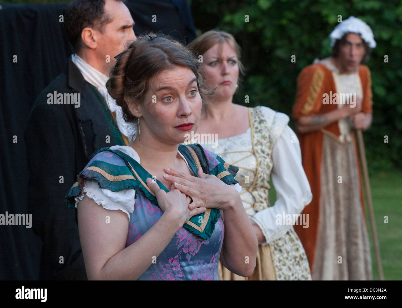 Amdram facial expressions at a garden performance of a French farce Stock Photo Alamy