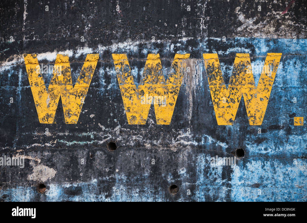 Dark blue concrete wall with yellow www label. Photo background texture Stock Photo