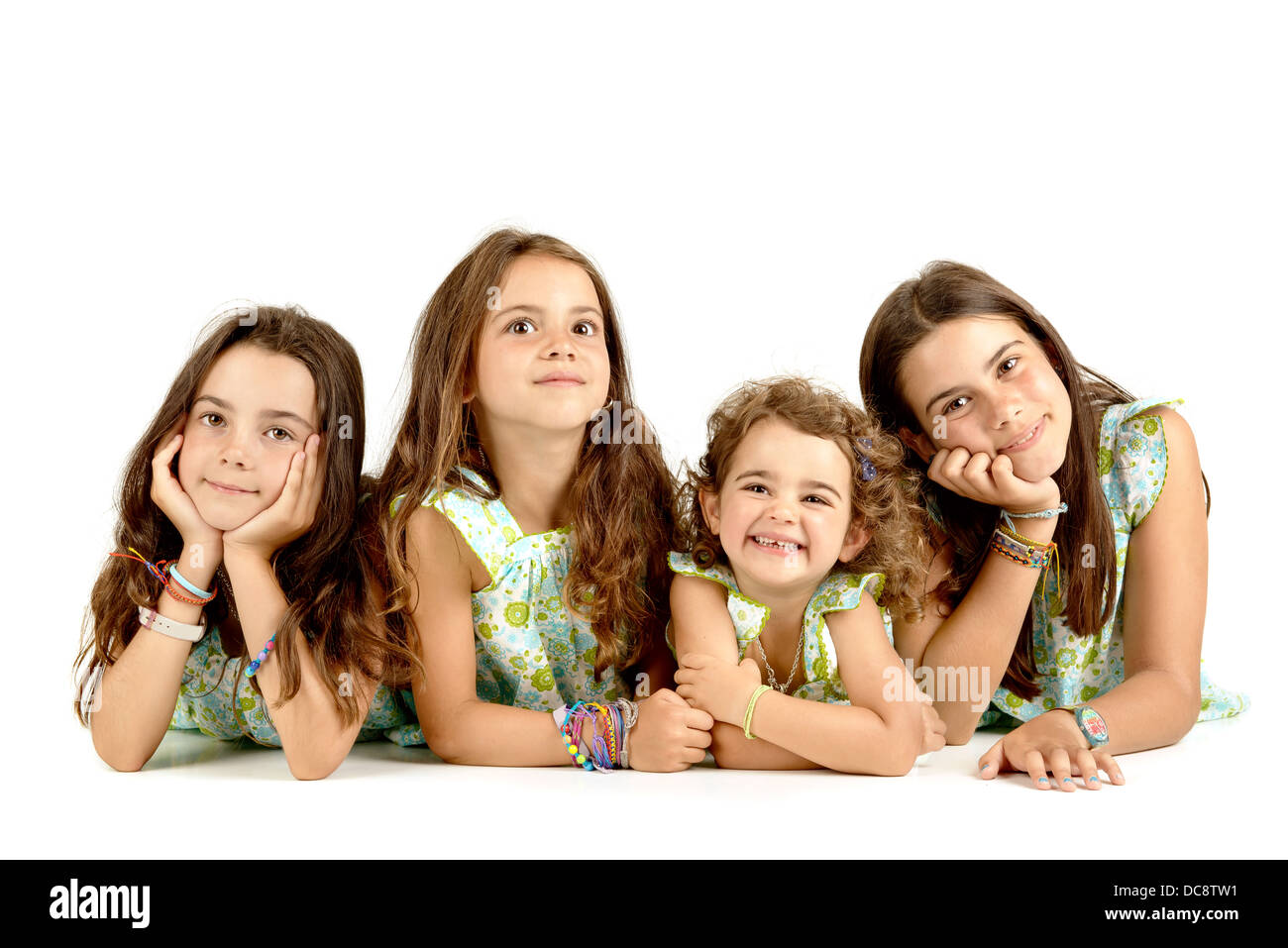 Group of young girls posing isolated Stock Photo - Alamy