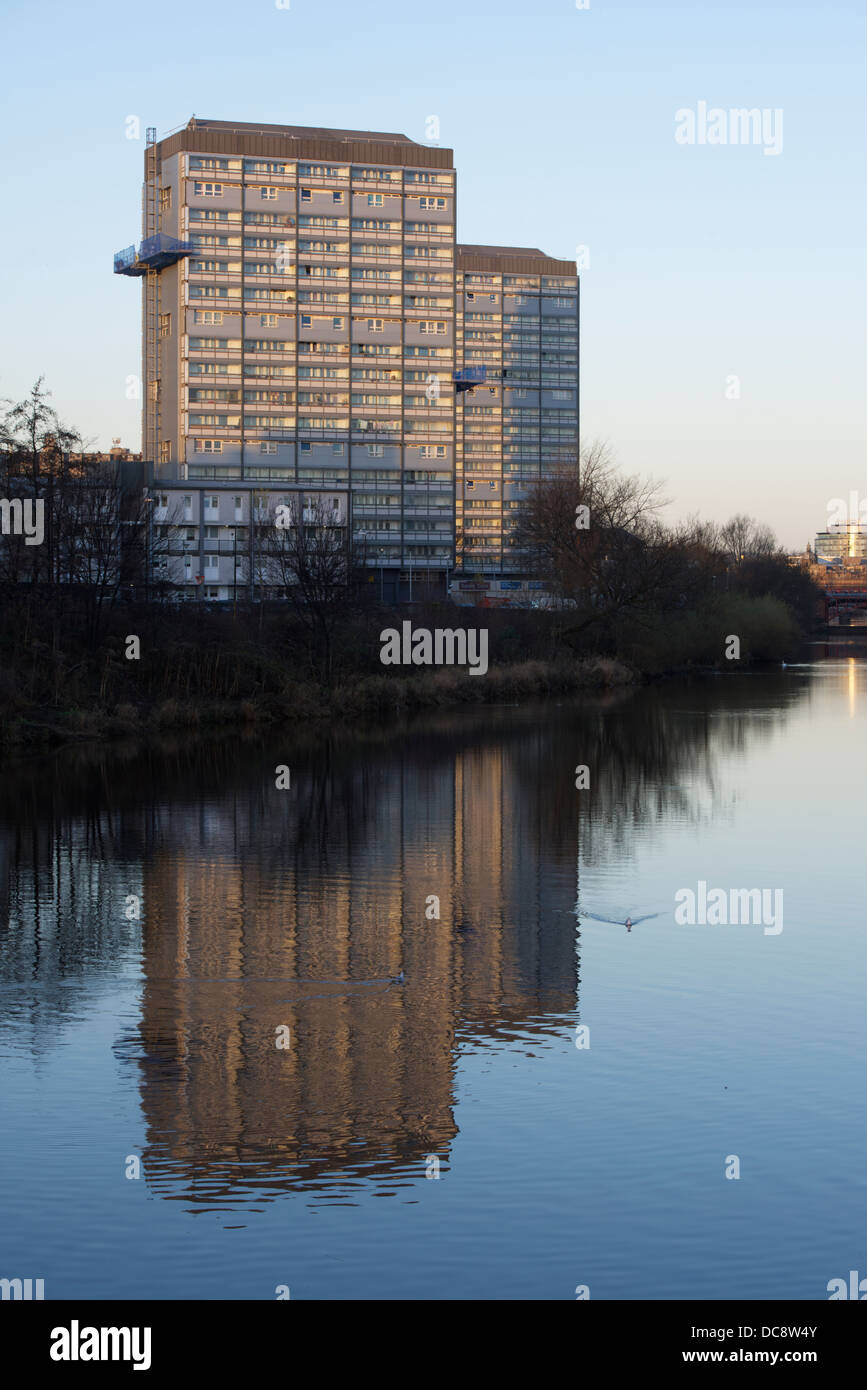 Waddell Court high rise flats reflected in the River Clyde at dawn