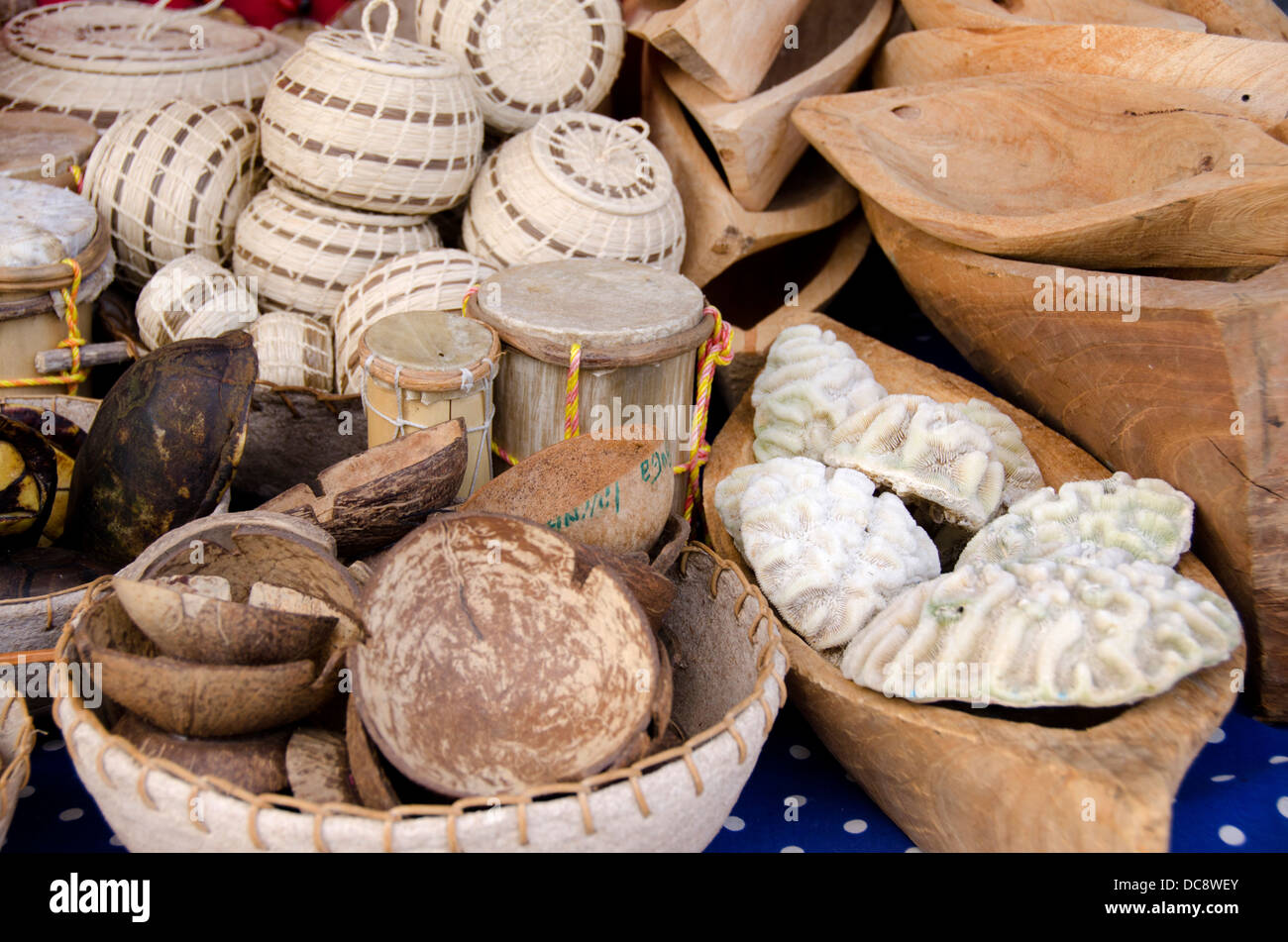 Guatemala, Livingston. Typical souvenir stand with hand woven baskets, hand carve wooden canoes and sea coral. Stock Photo