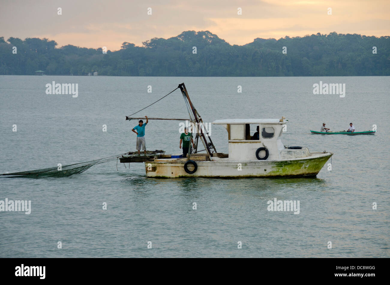 Guatemala, Rio Dulce, Livingston. Early morning local fishing boat