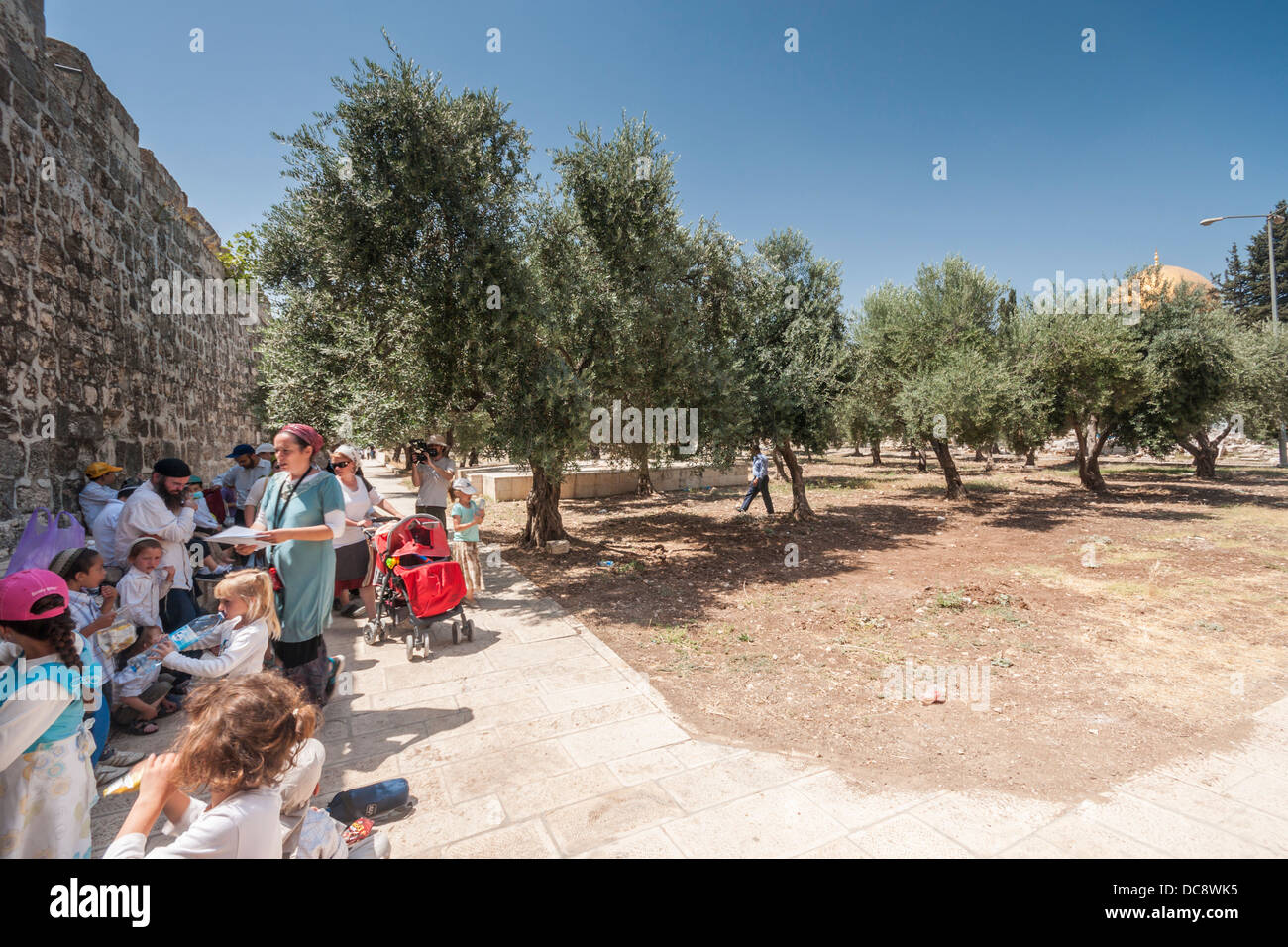 Jerusalem, Israel. Yael Kabilio of the 'Women for the Temple' group, leads a group of children in a tour of the Temple mount. Stock Photo