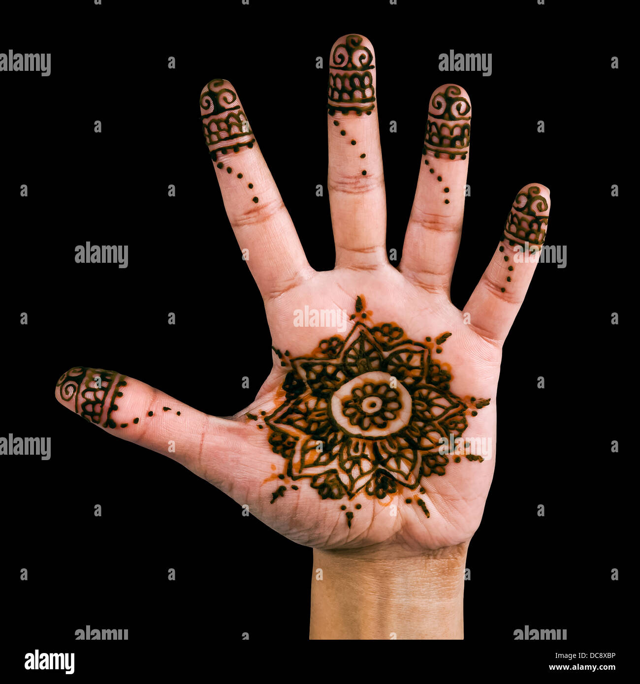 Henna design on the palm of the hand - isolated in black Stock Photo