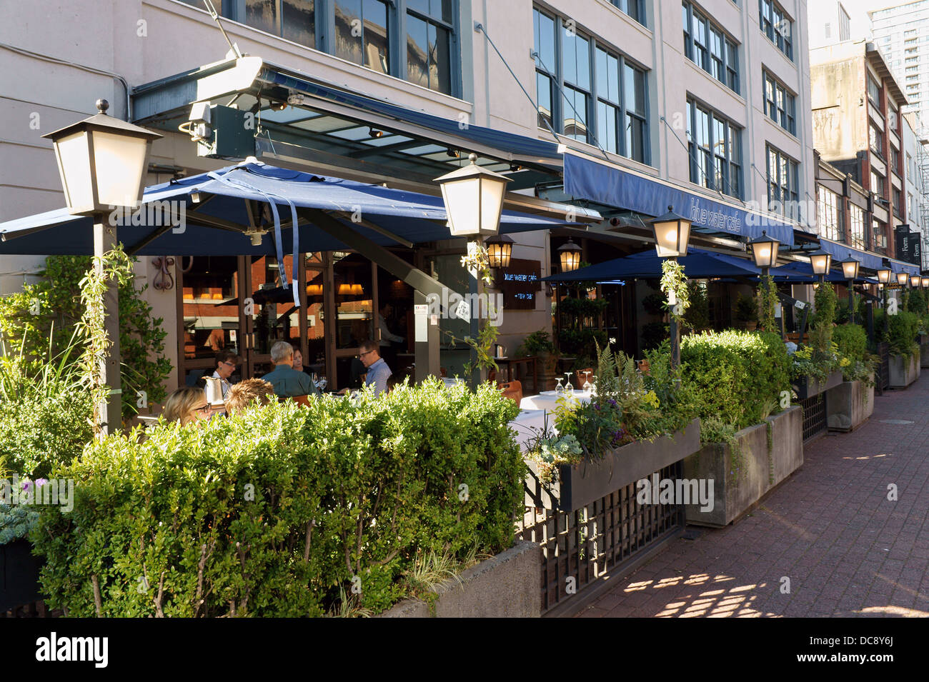 Outdoor patio of the Blue Water Cafe in Yaletown, Vancouver, British Columbia, Canada Stock Photo