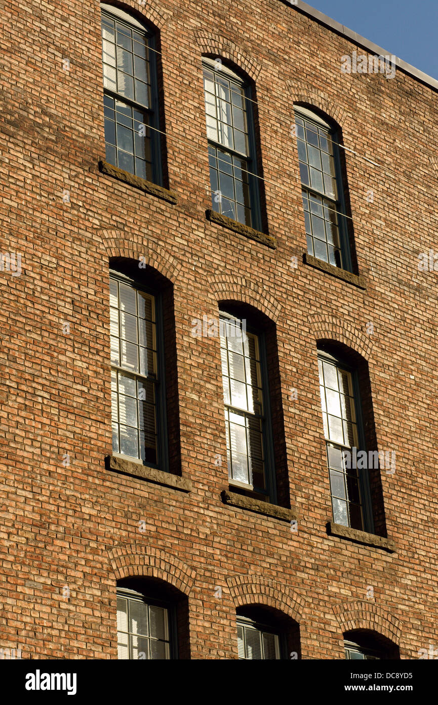 Sunlit brick facade of an old building in Yaletown, Vancouver, British
