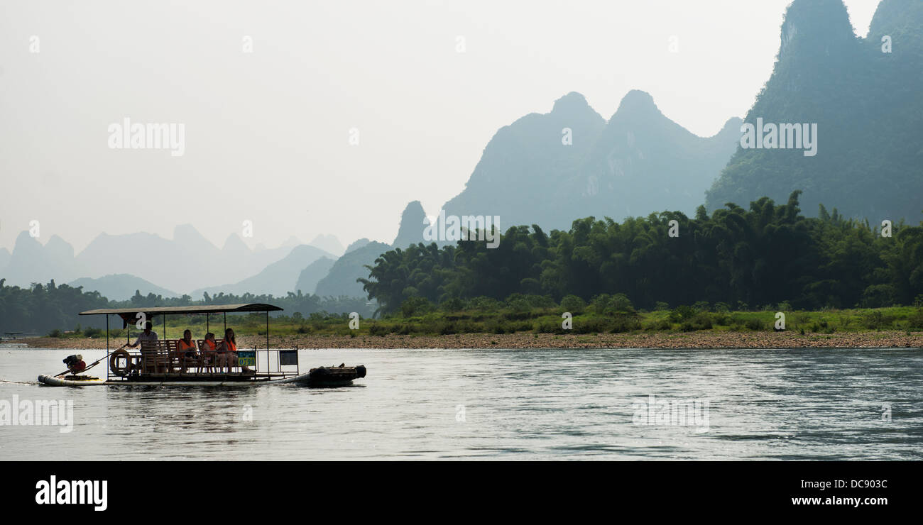 Tourists take a boat ride down the River Li; Guilin, Guangxi, China Stock Photo