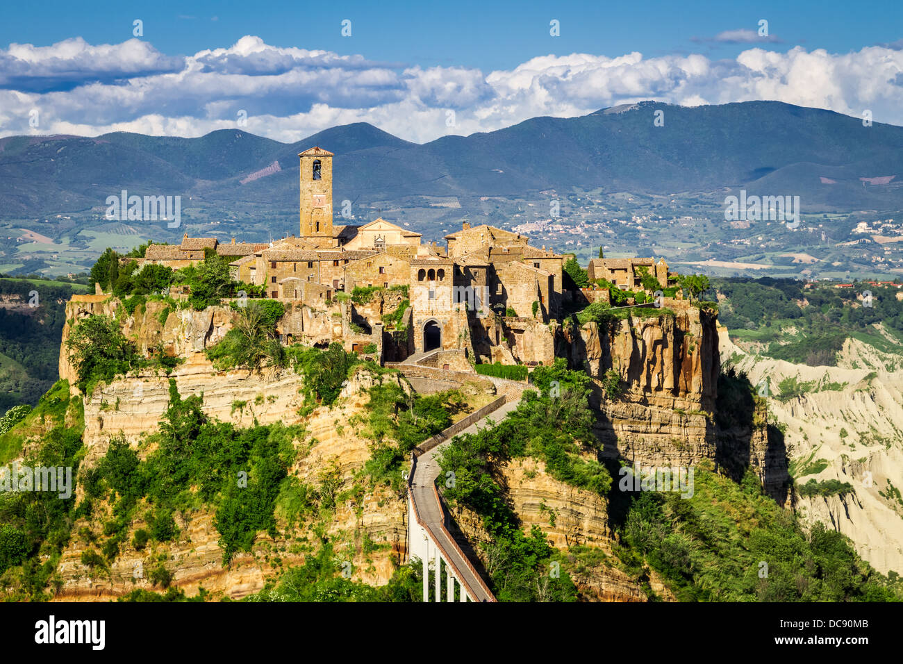 Ancient city on hill in Tuscany on a mountains background Stock Photo ...