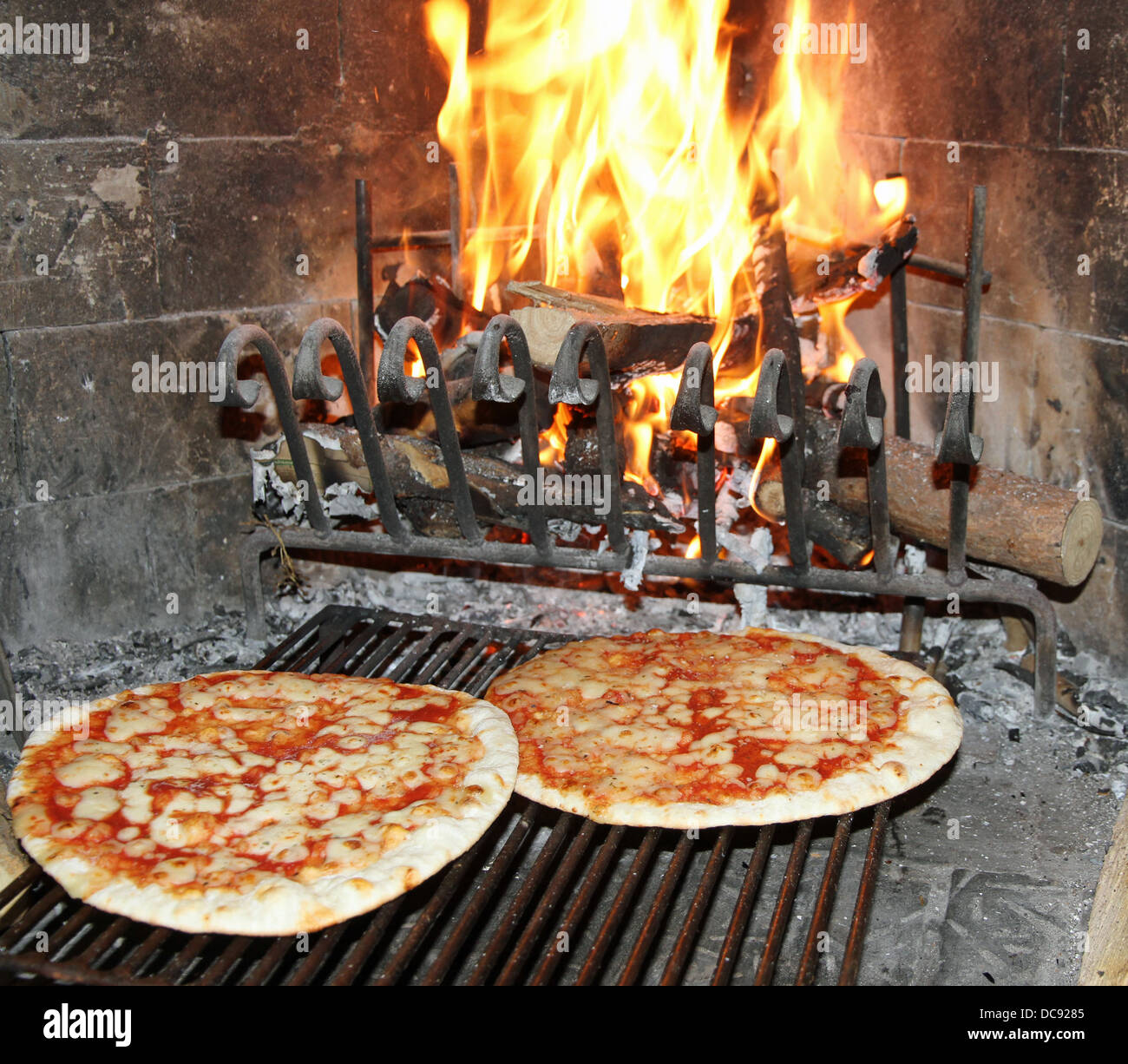 excellent fragrant pizza baked in a wood fireplace with a wood-burning oven pizzeria 3 Stock Photo
