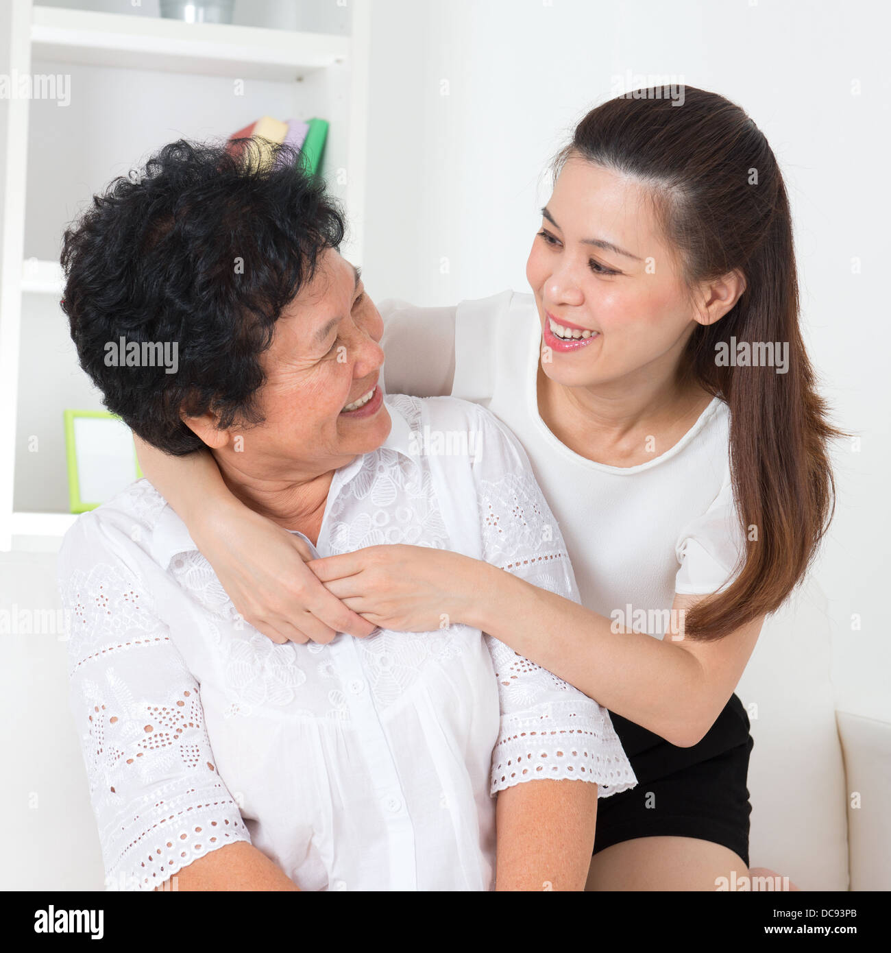 Senior woman and daughter. Happy Asian family senior mother and adult offspring having fun time at home. Stock Photo