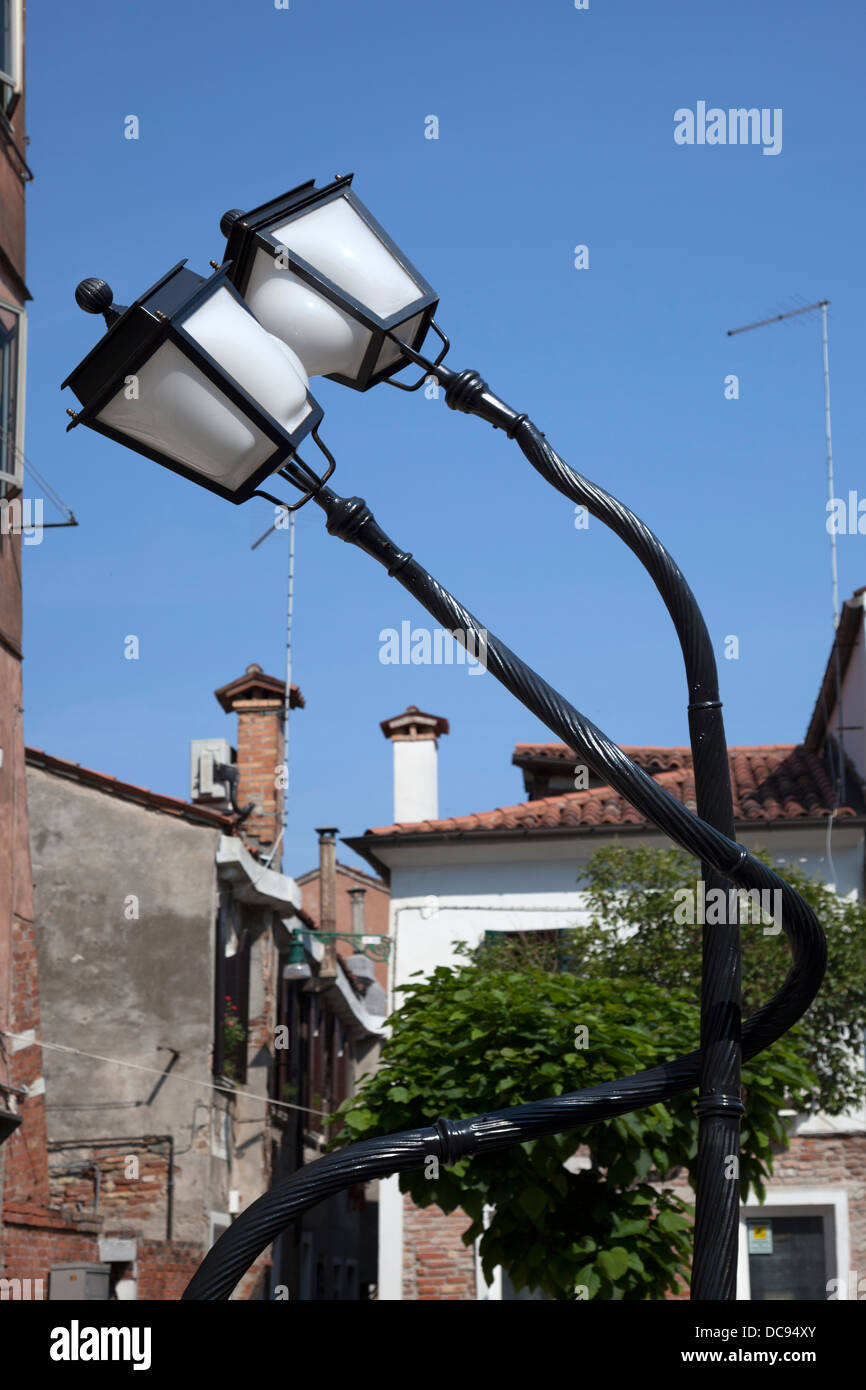 When twisting lamp posts results in whimsical forms: a Pieke Bergmans' work. Paire de lampadaires enroulés: oeuvre de P.Bergmans Stock Photo