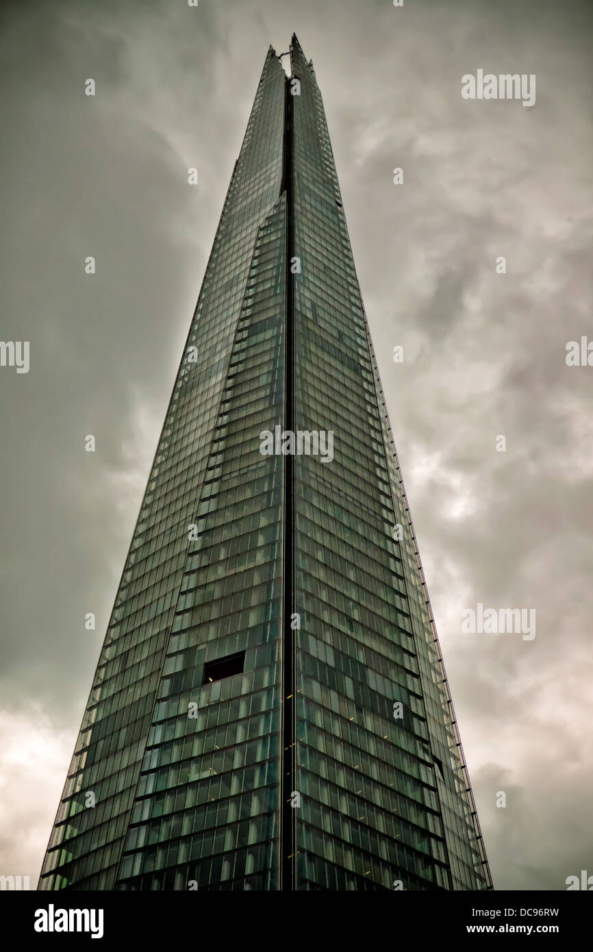 The shard tower in London, pictured against severe rain clouds and bad weather Stock Photo