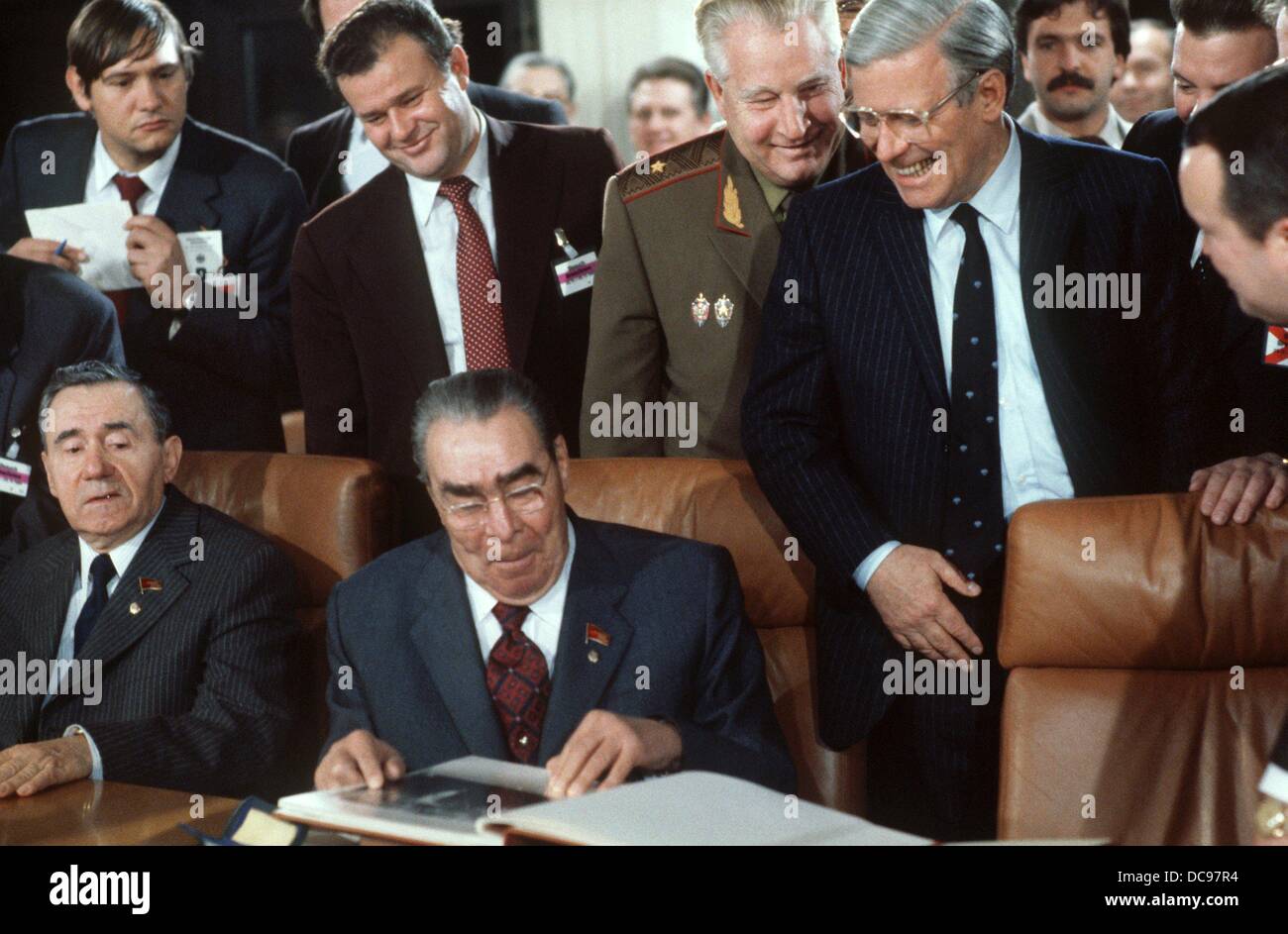 Chancellor Helmut Schmidt (r) takes a seat next to Soviet state president Leonid Brezhnev during a dinner of the two delegations in November 1981 in Bonn. To the left Soviet foreign minister Andrei Gromyko. Stock Photo