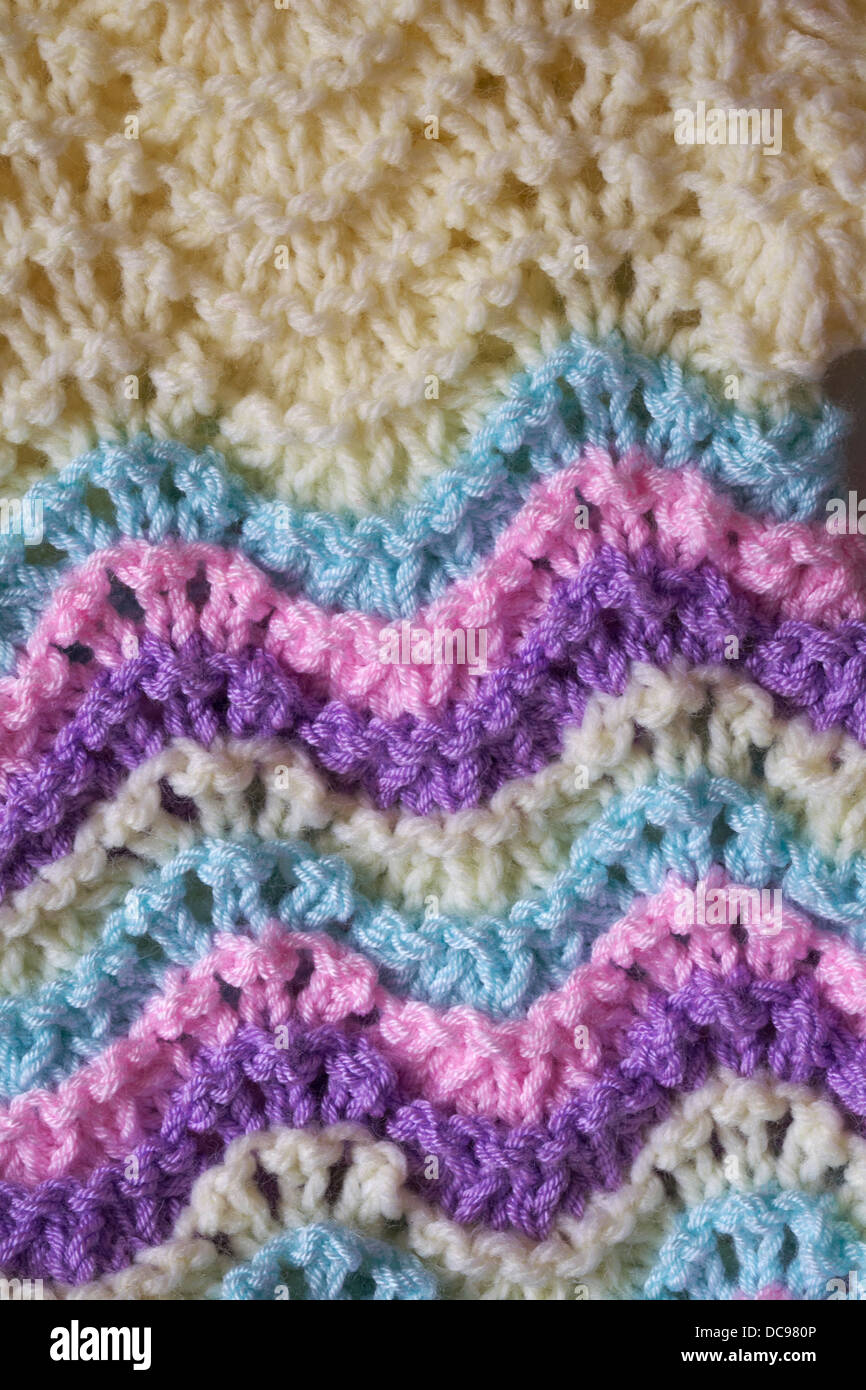 detail of colourful knitted baby jumper in pastel colours - abstract background Stock Photo