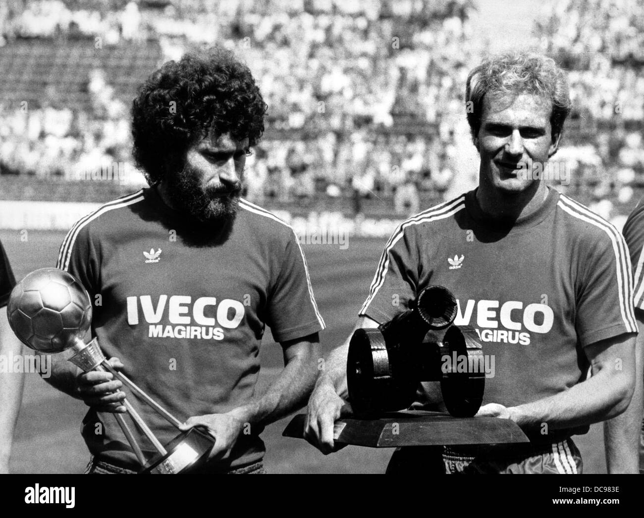 Karl-Heinz Rummenigge (r) and Paul Breitner from FC Bayern Munich are honoured shortly before the match against Bayer Leverkusen on the 8th of August in 1981. Stock Photo
