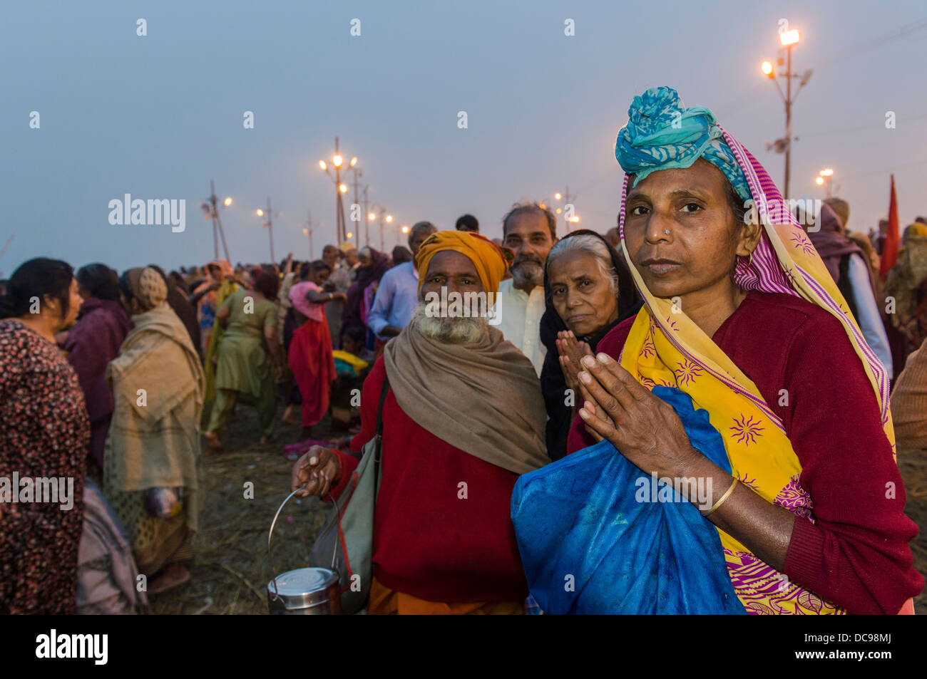 People praying in the early morning, Kumbha Mela mass Hindu pilgrimage Stock Photo