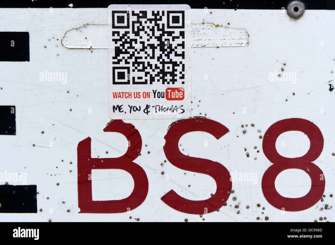 Me, You & Thomas Watch Us on You Tube sticker with QR code on a Bristol BS8 street sign. Stock Photo