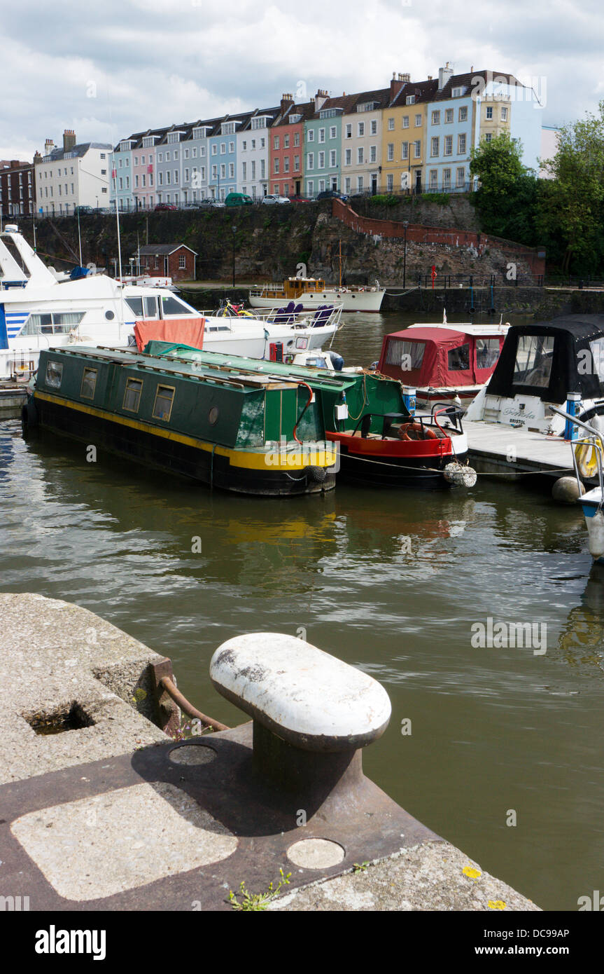 A terrace of colourful houses in Redcliffe Parade seen across the Floating Harbour in Bristol. Stock Photo