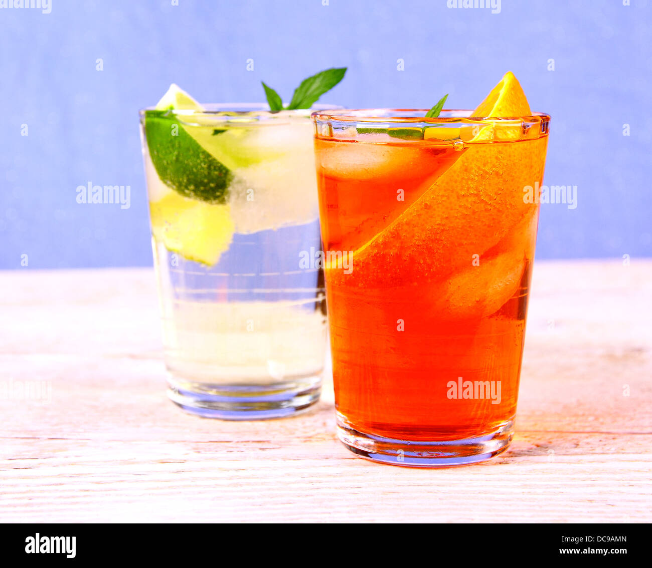 Orange and elderflower cocktails on blue background, close up Stock Photo