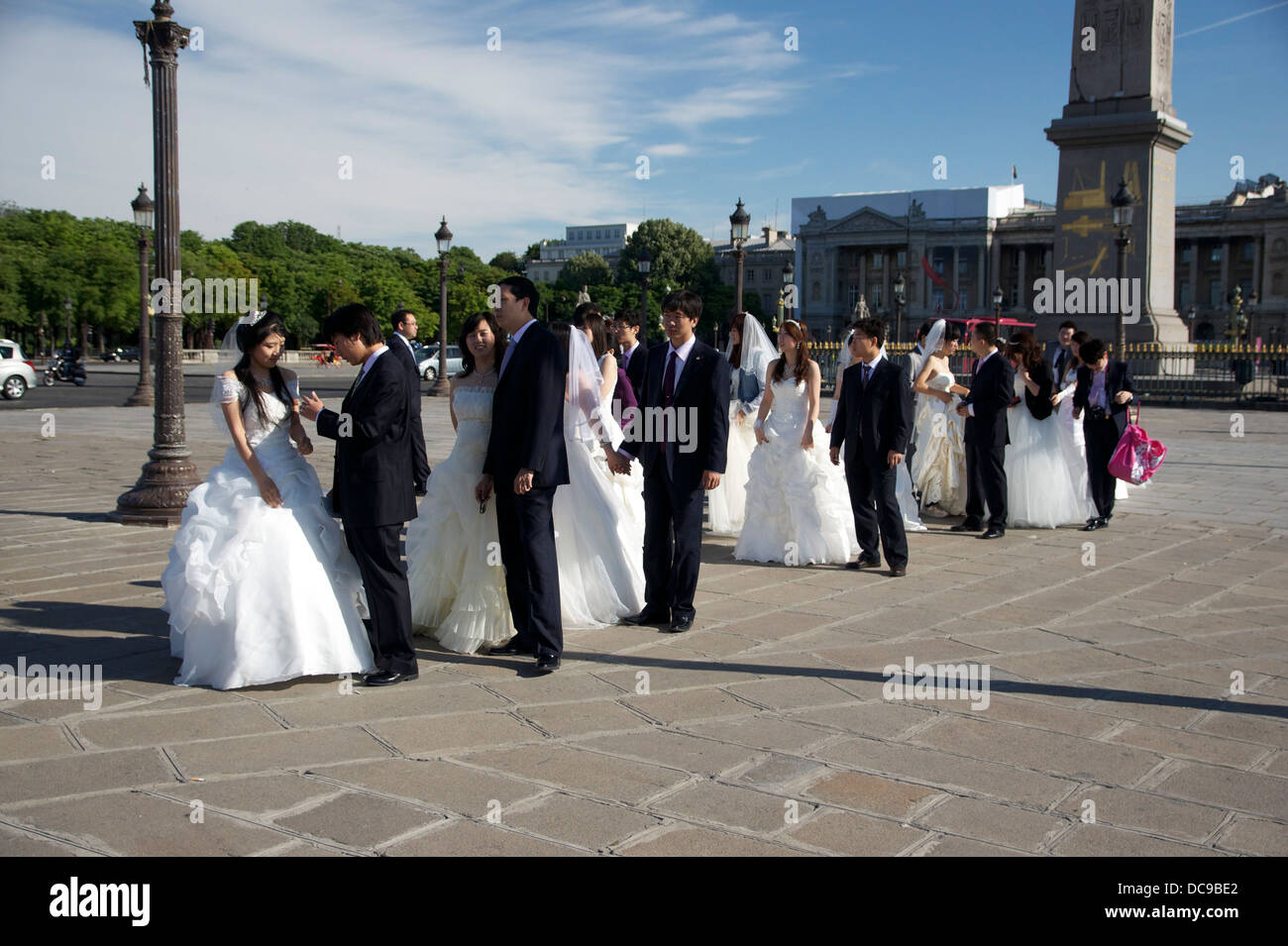 Just married, waiting in a file for a picture place de la Concorde in Paris, a sunday morning. Stock Photo