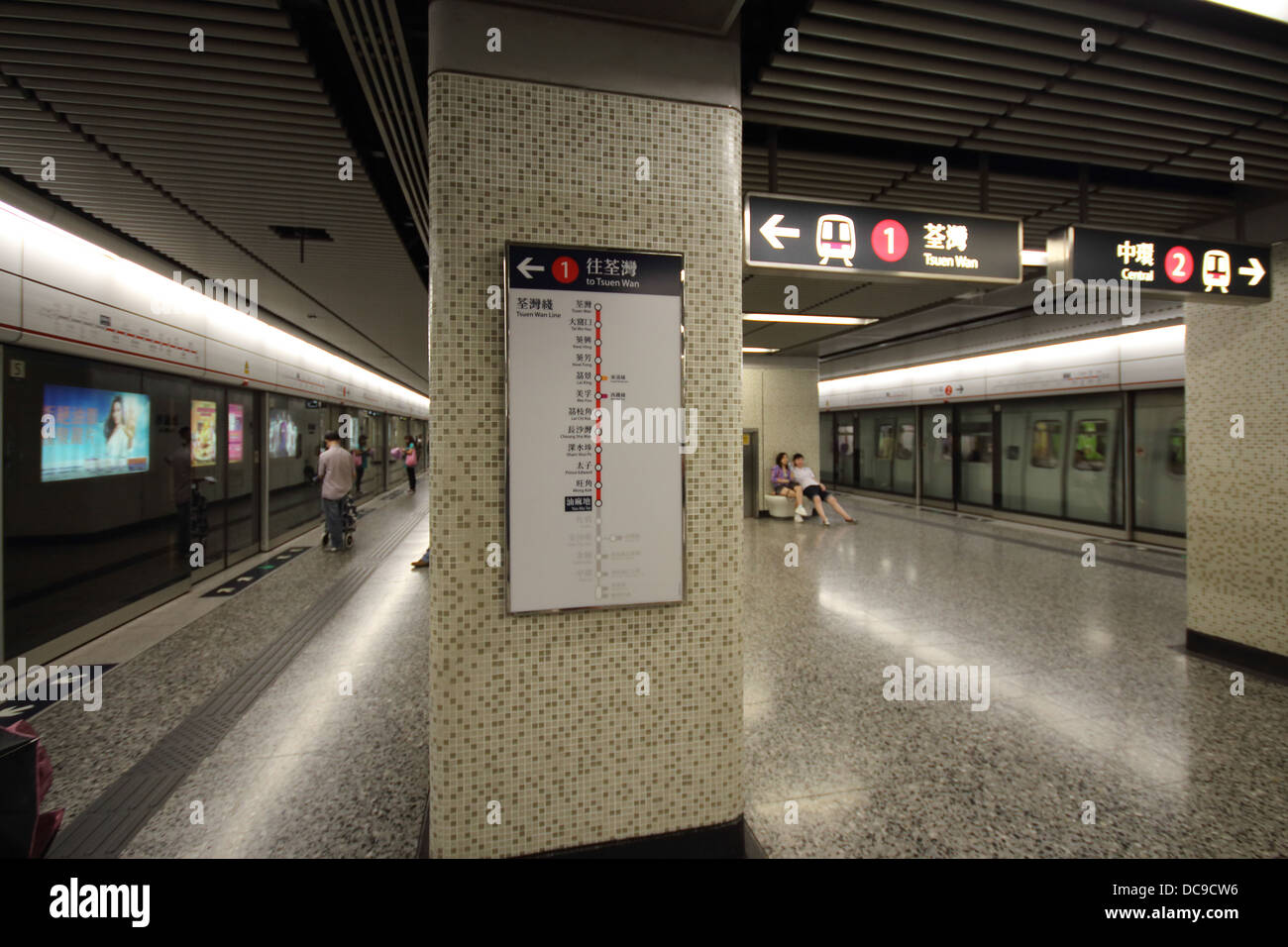 Waiting for a train at Kowloon MTR platform Stock Photo