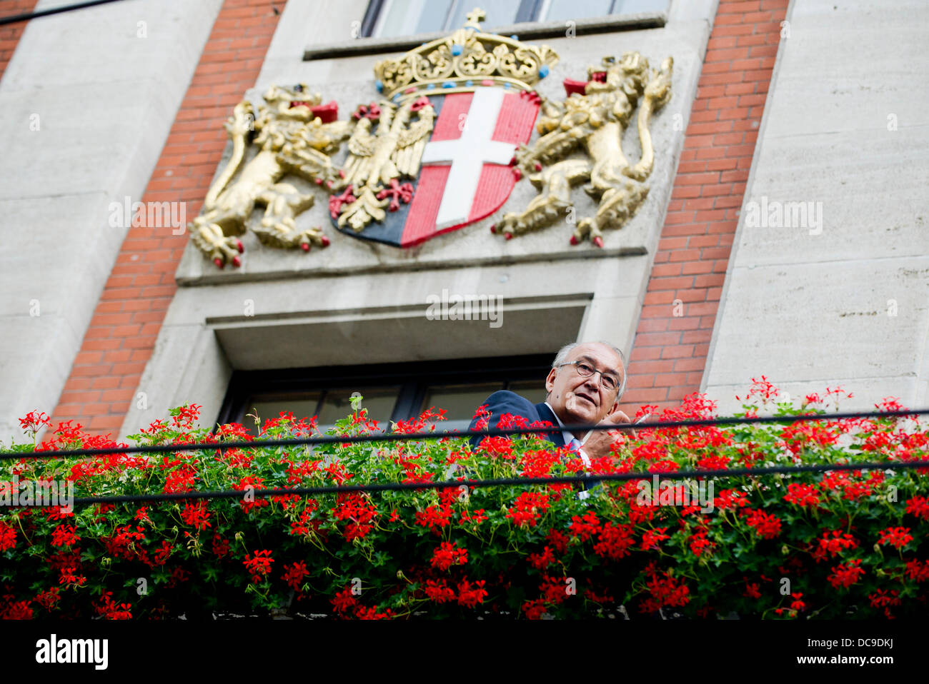 Mayor of Neuss Herbert Napp smokes on the balcony outside his office in city hall in Neuss, Germany, 13 August 2013. Napp is planning to challenge an official order that prohibits him from smoking in his office. Photo: JAN-PHILIPP STROBEL Stock Photo
